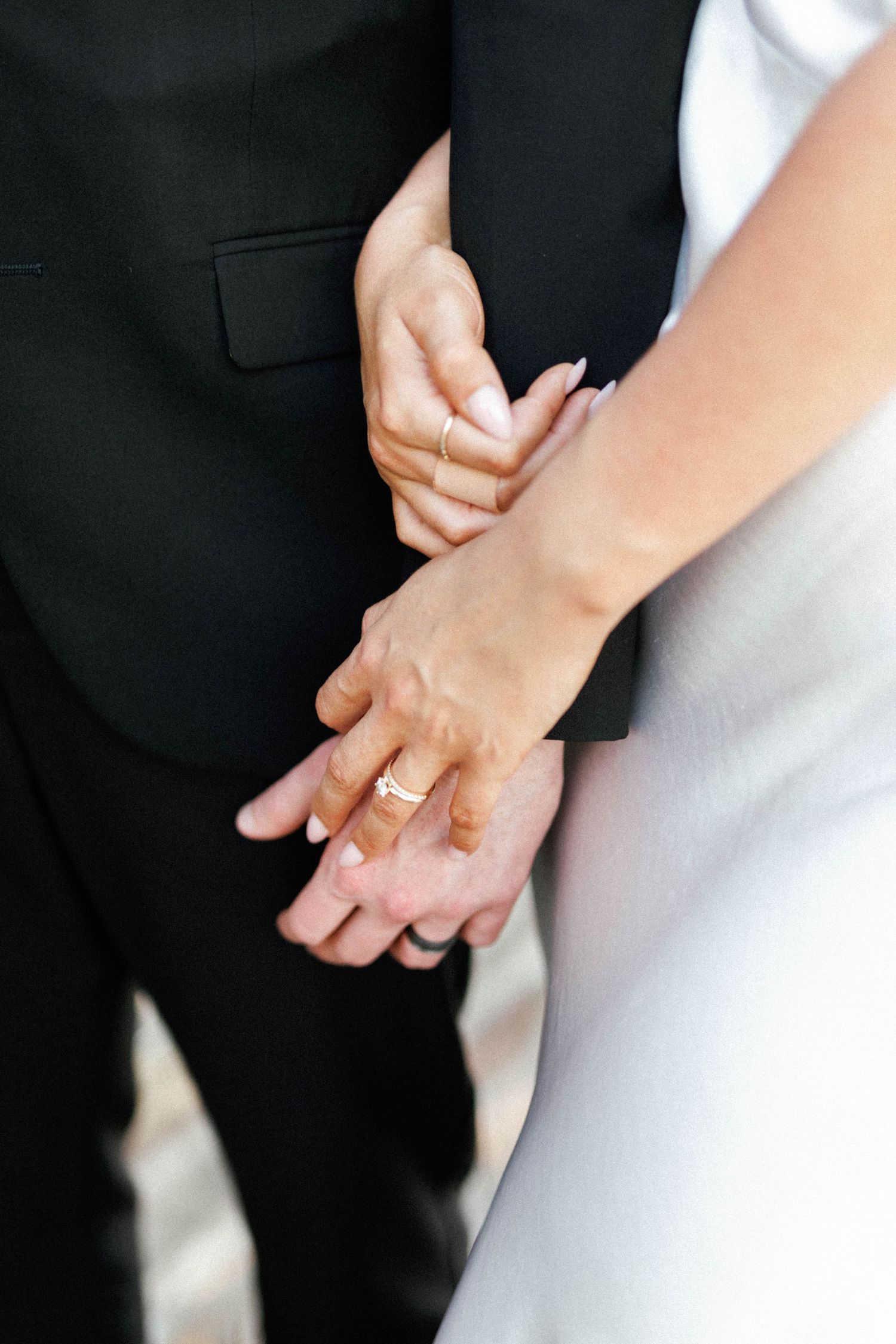 Close-up of Brooke and Lloyd holding hands on North Terrace in Adelaide