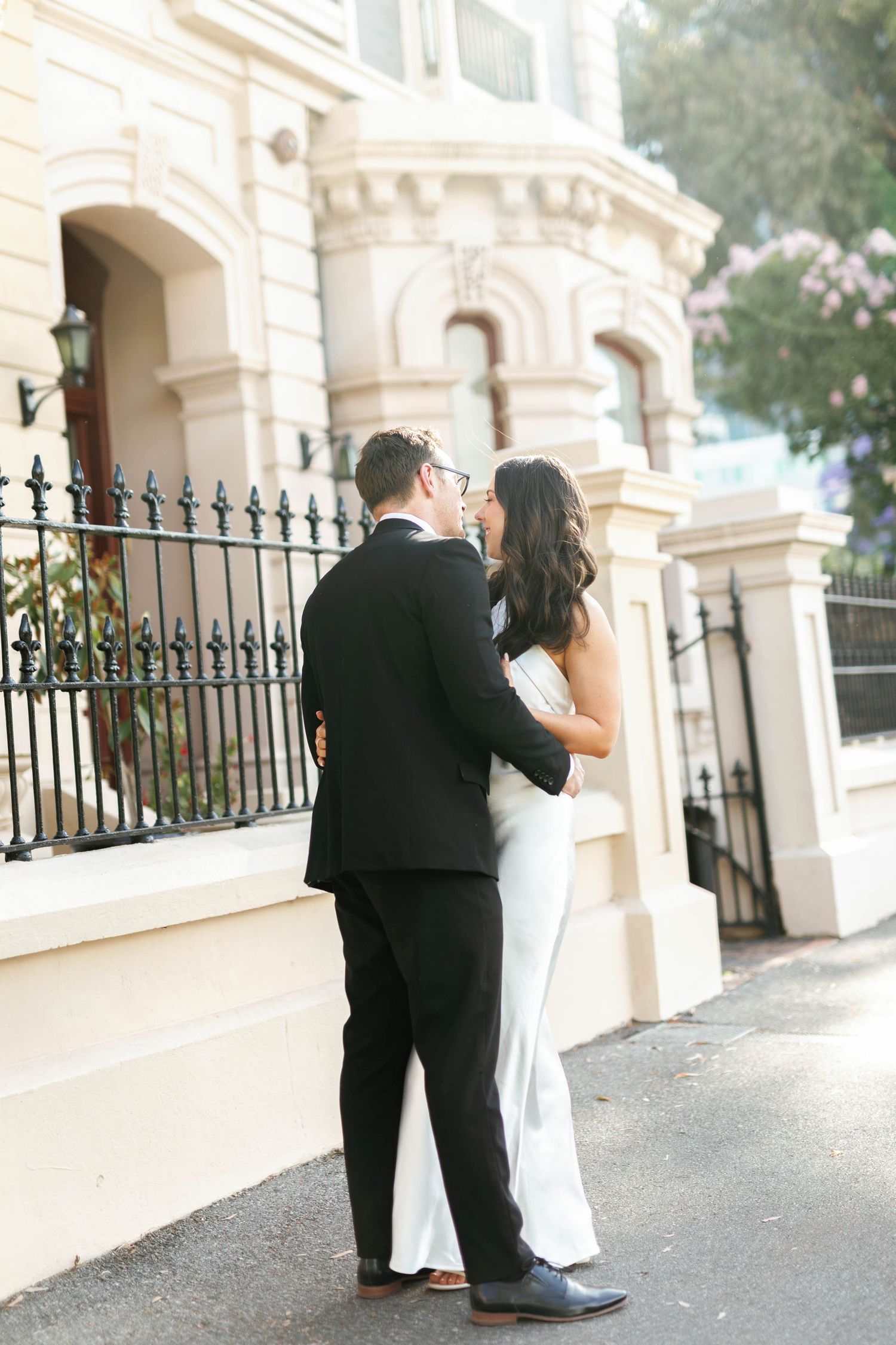 Brooke and Lloyd standing together outside a historic North Terrace building