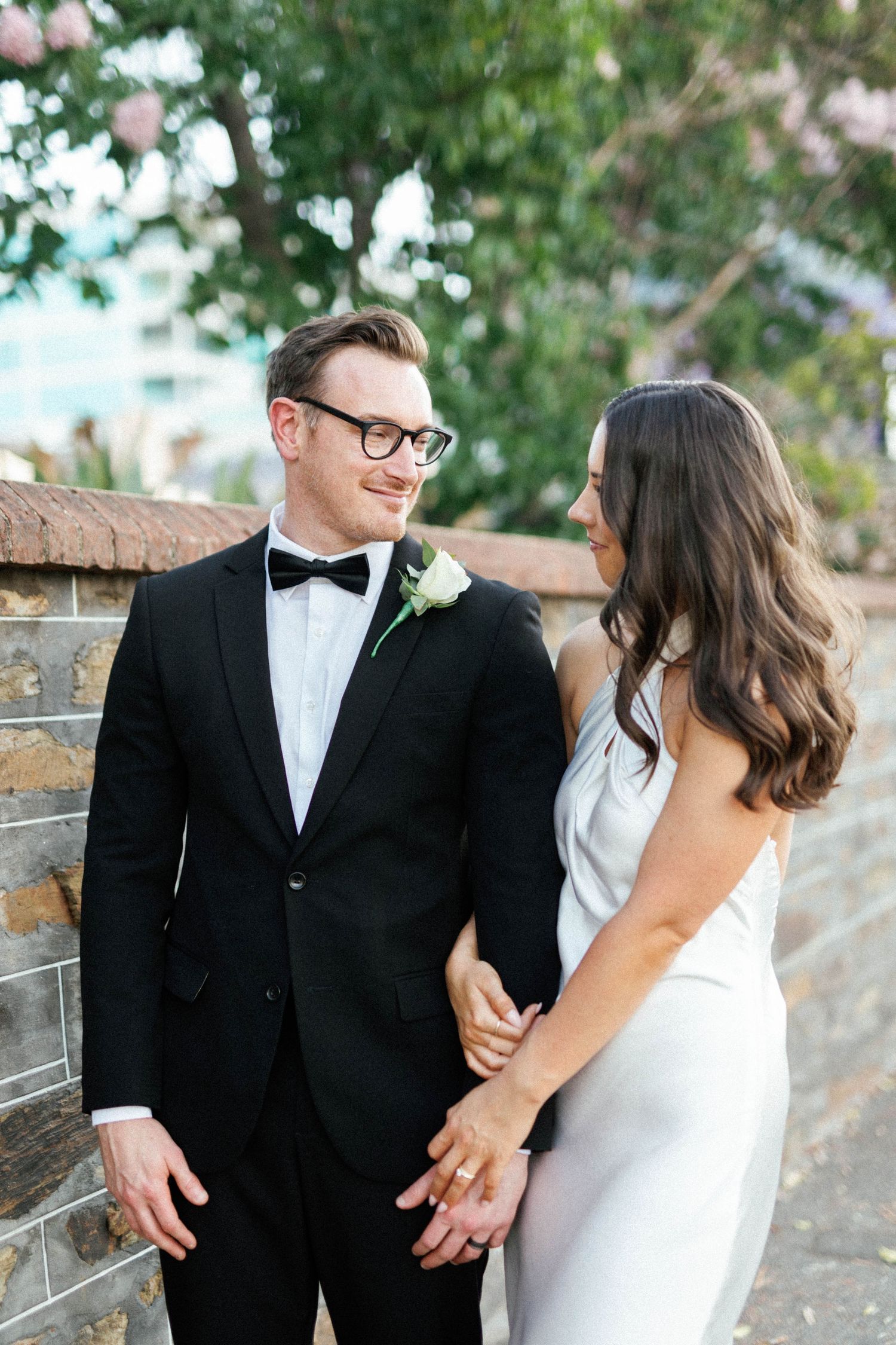 Brooke and Lloyd facing each other beneath the trees during their Adelaide elopement portraits