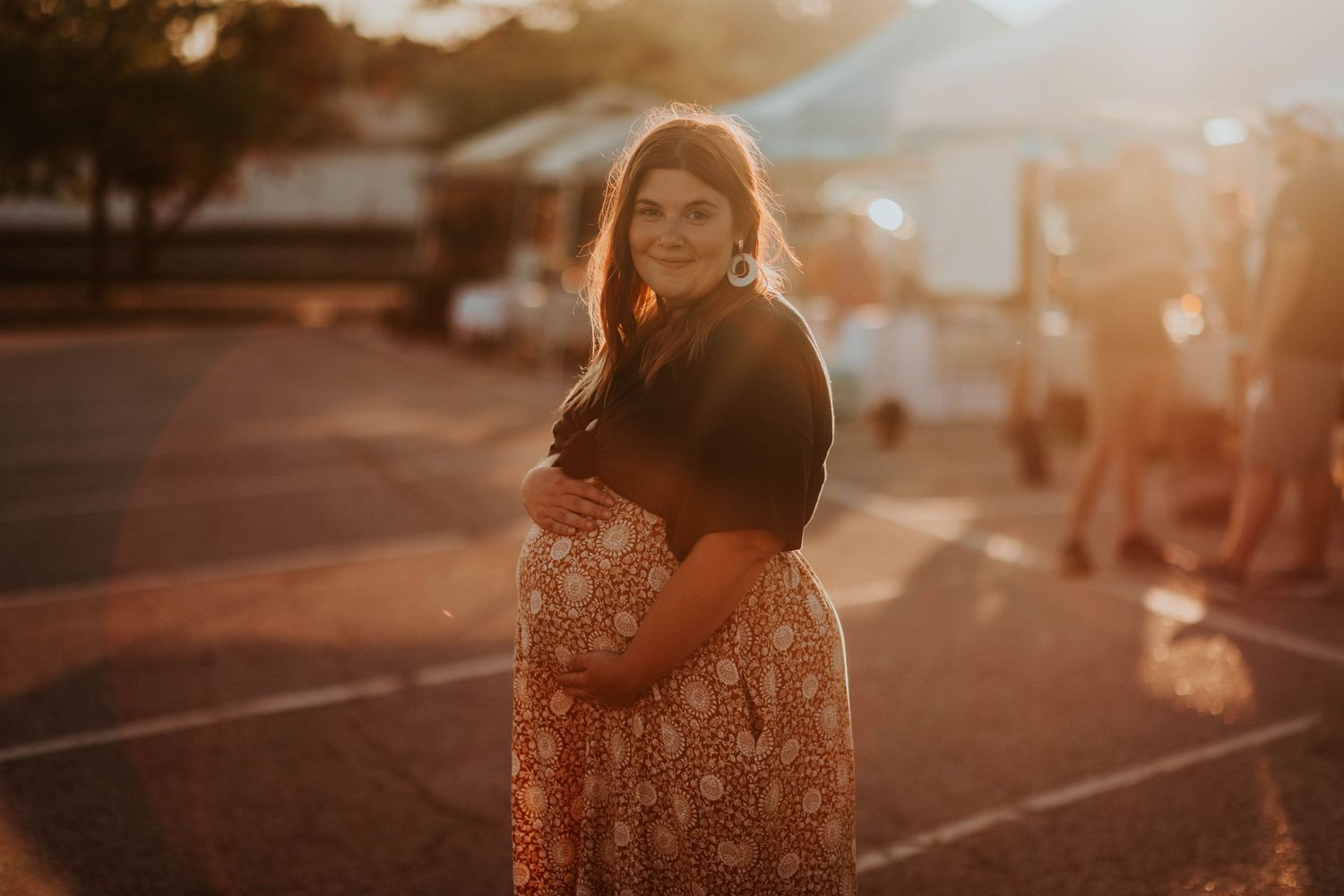 Photo of business owner pregnant and in evening sun outdoors