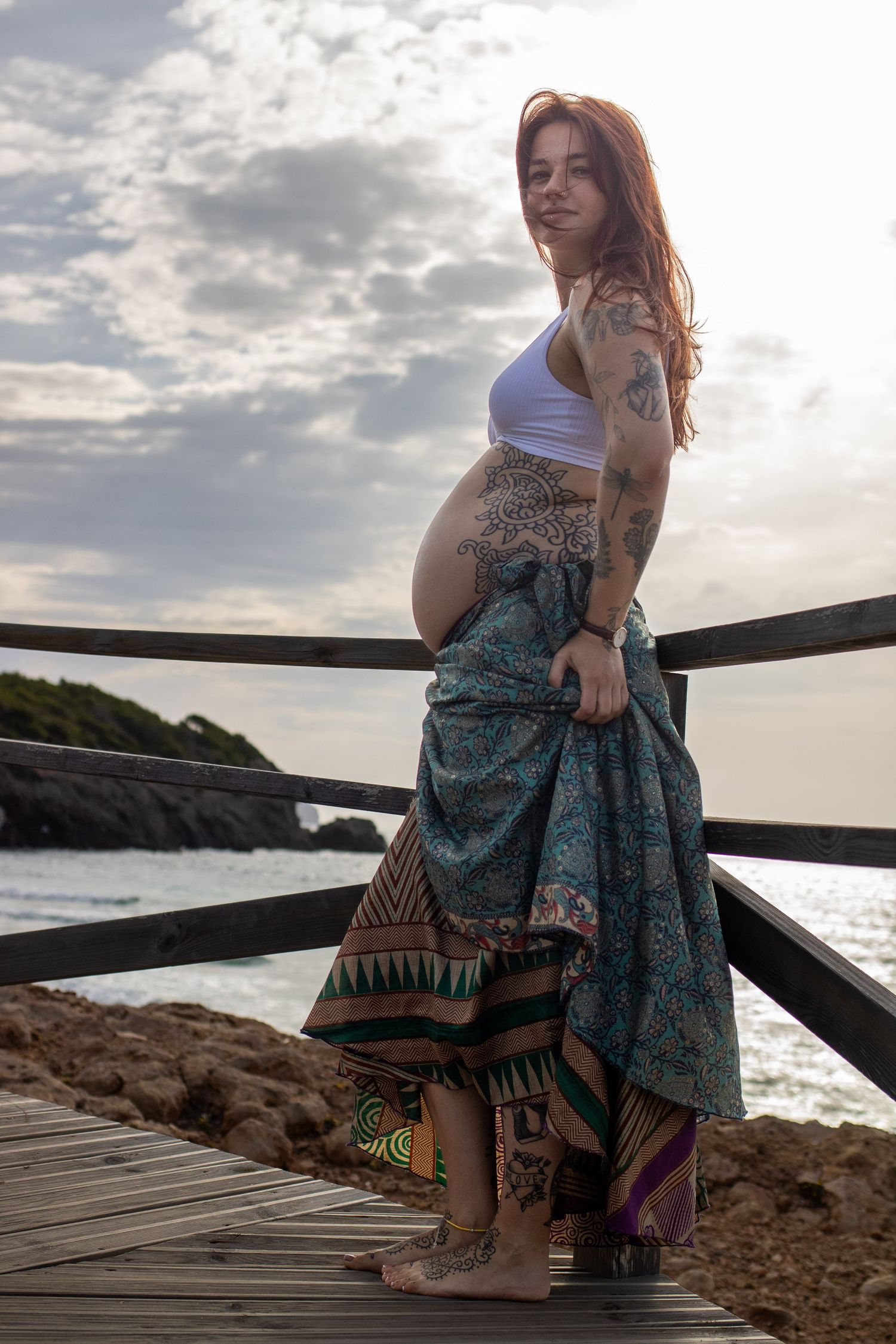 Pregnant mother enjoying a peaceful maternity moment by the ocean on the Central Coast of California.