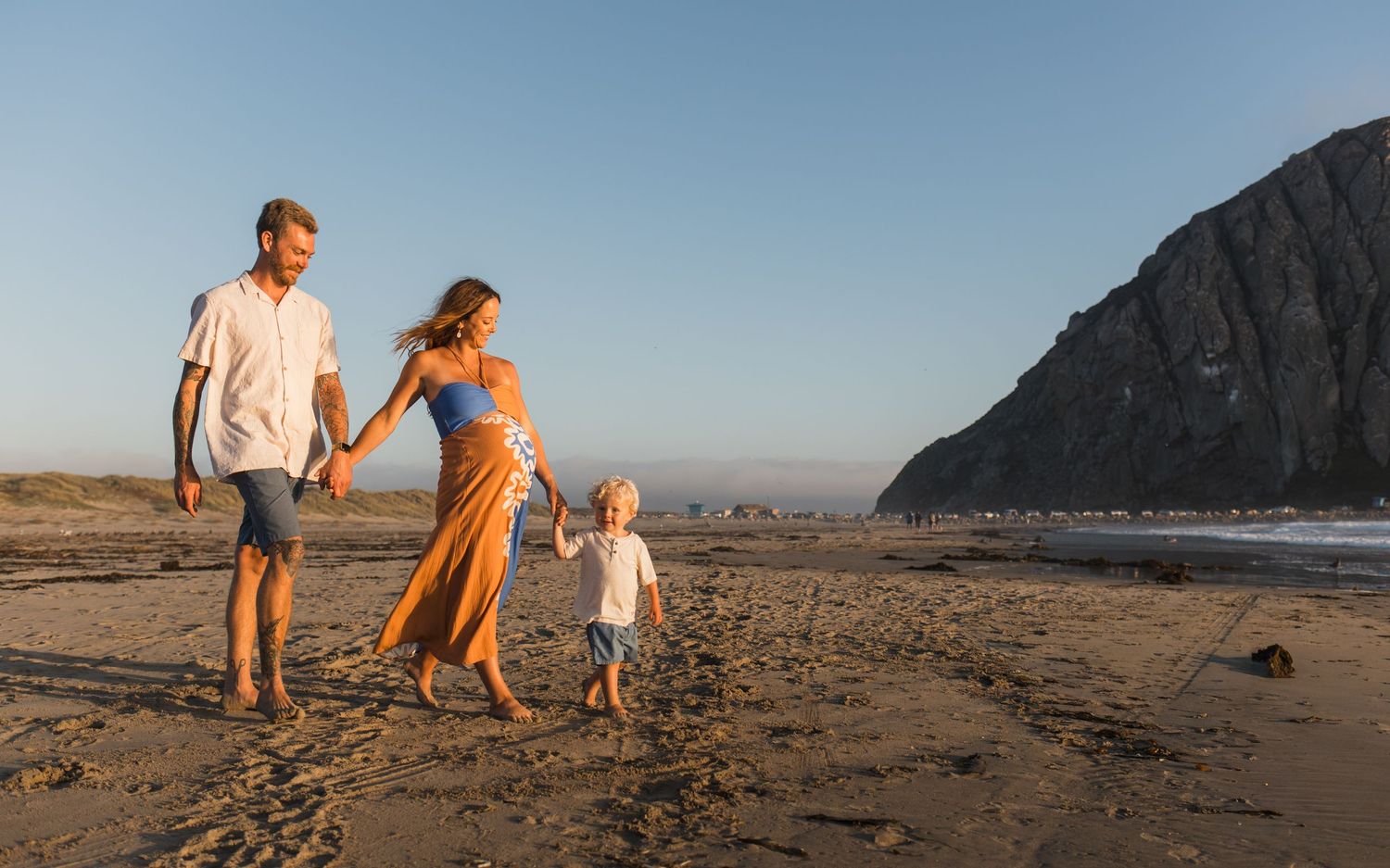 Family walking together on the beach in Cayucos, California
