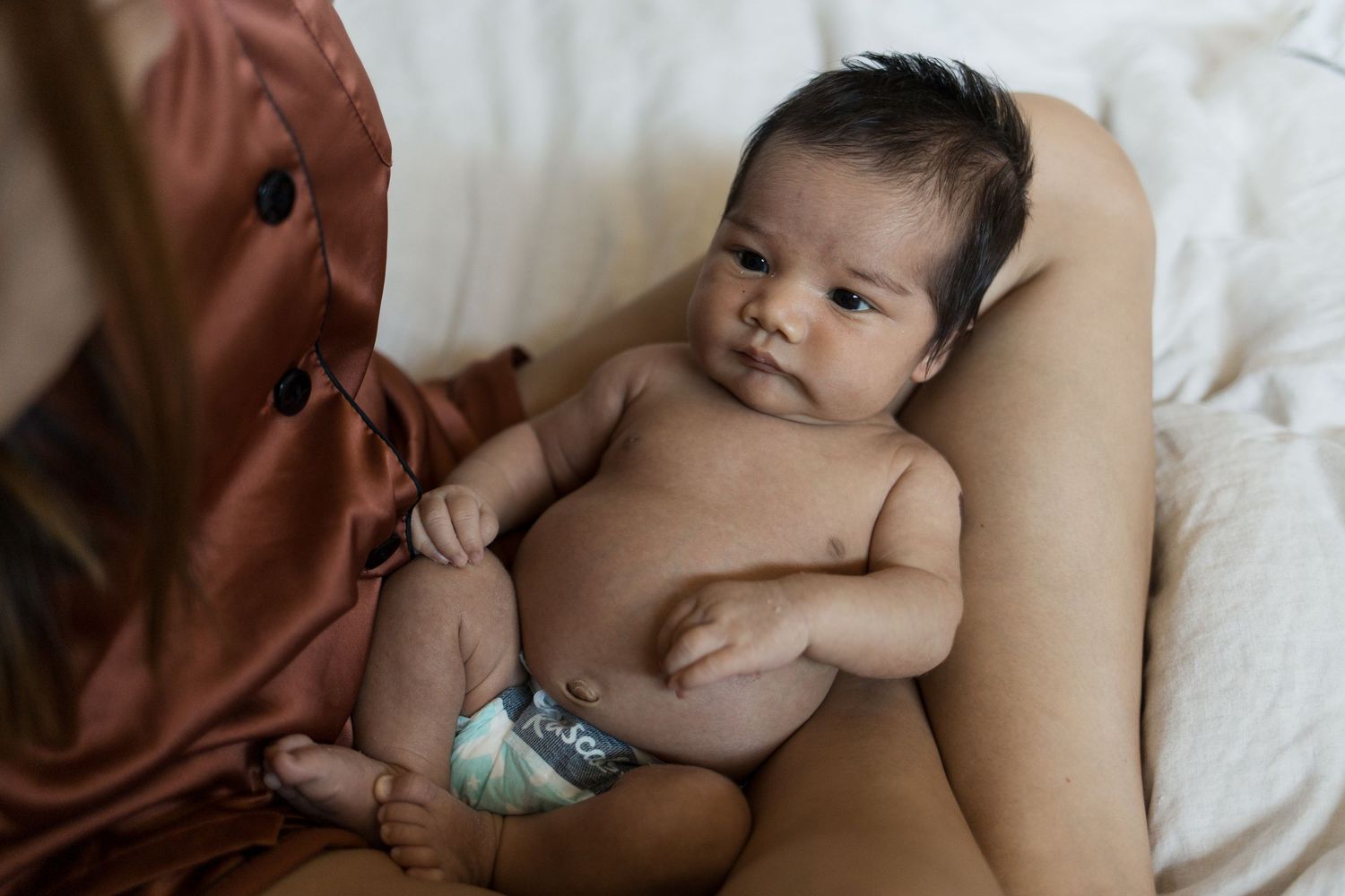 Sweet baby photographed during a natural lifestyle newborn photography session in California.