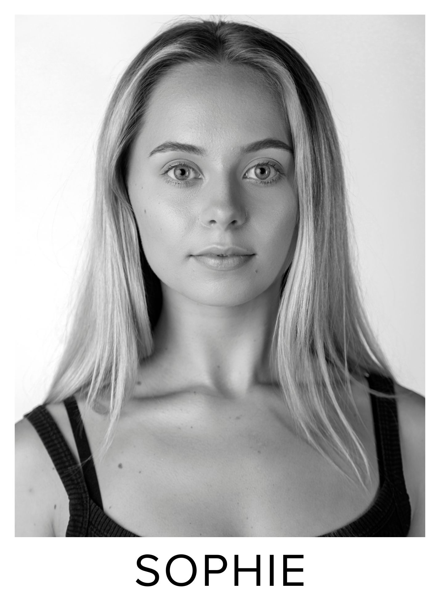 Black and white headshot of Sophie, a young blonde woman with straight hair, wearing a black top.