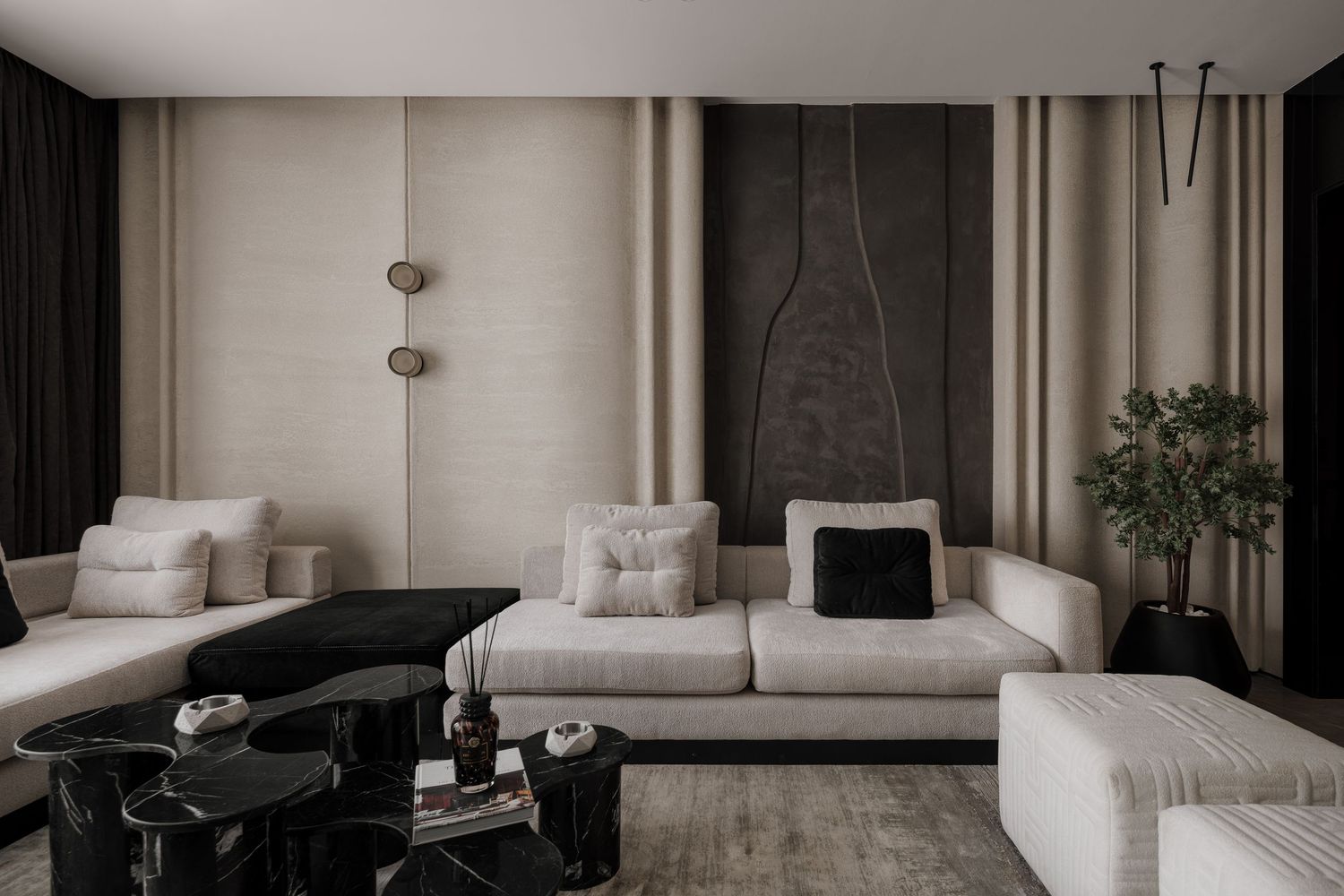 Modern living room with beige sectional sofa, black coffee tables, and textured accent wall.