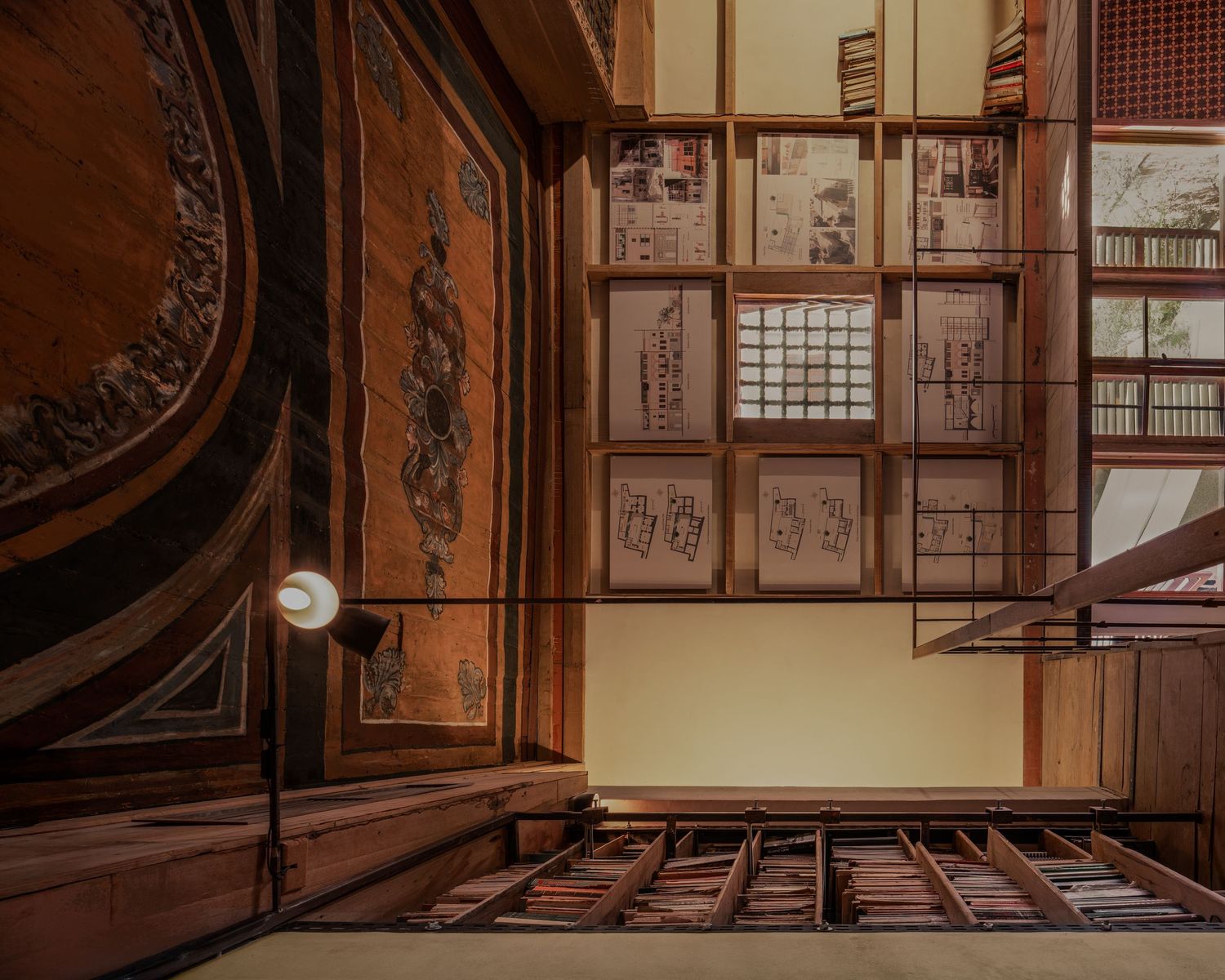 Ornate wooden interior with carved panels, framed calligraphy artwork, and traditional Japanese architectural details.