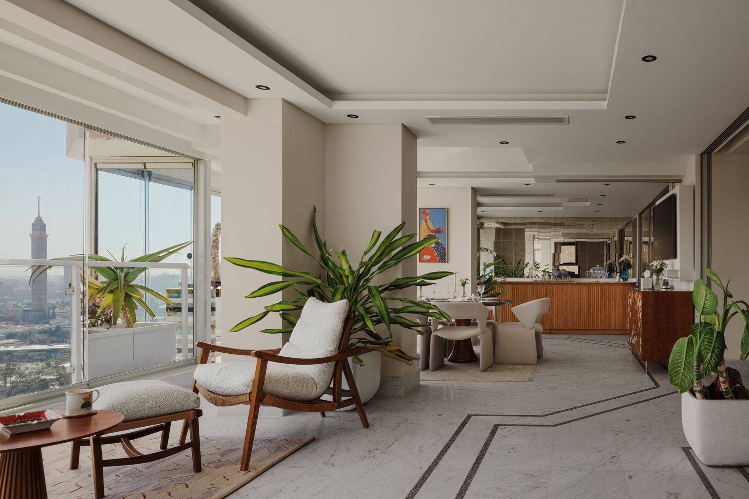Bright luxury penthouse interior featuring marble floors, wooden furniture, lush plants, and expansive city views.