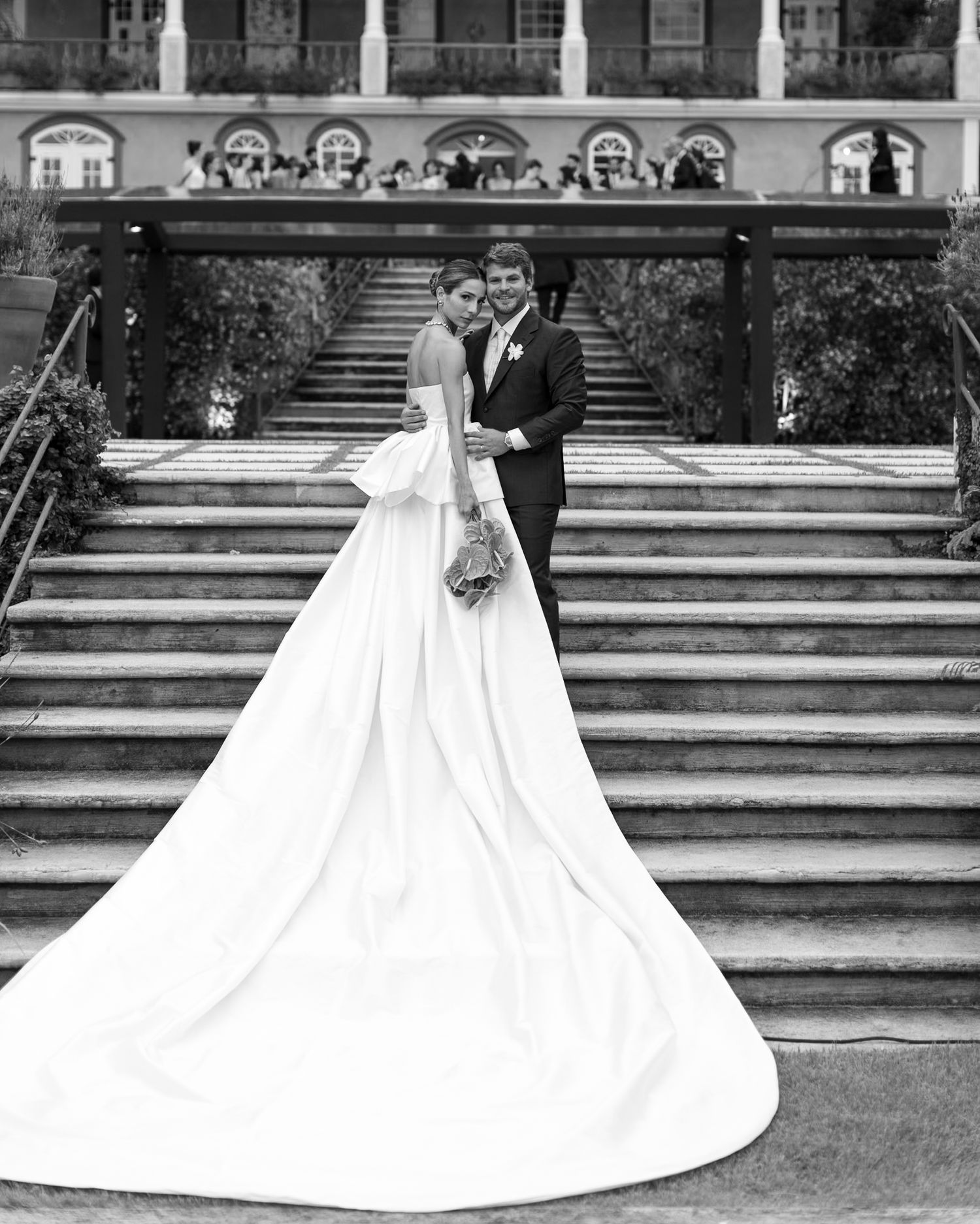 A black and white photo sequence shows a bride and groom descending stone steps in a formal garden setting.