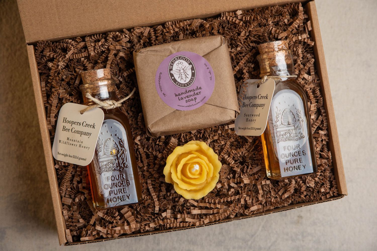 Honey, soap, and a candle in a gift box