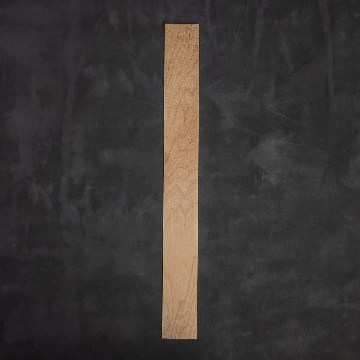 Product photograph of raw wood panel on a dark gray background.