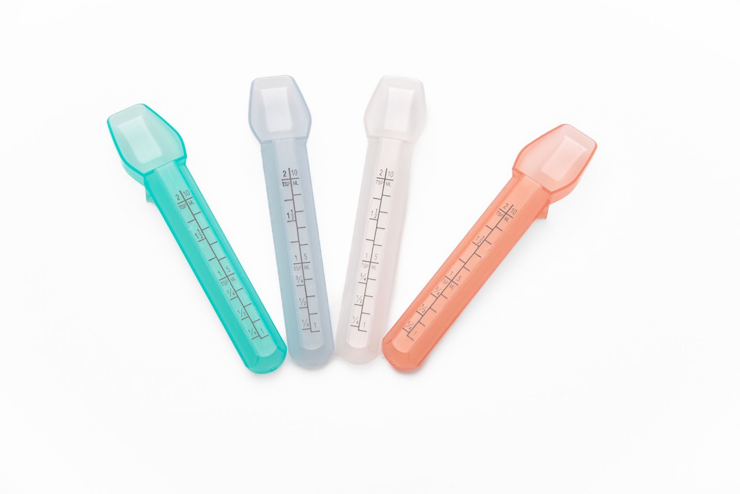 E-commerce shot of 4 different colored liquid medicine spoons