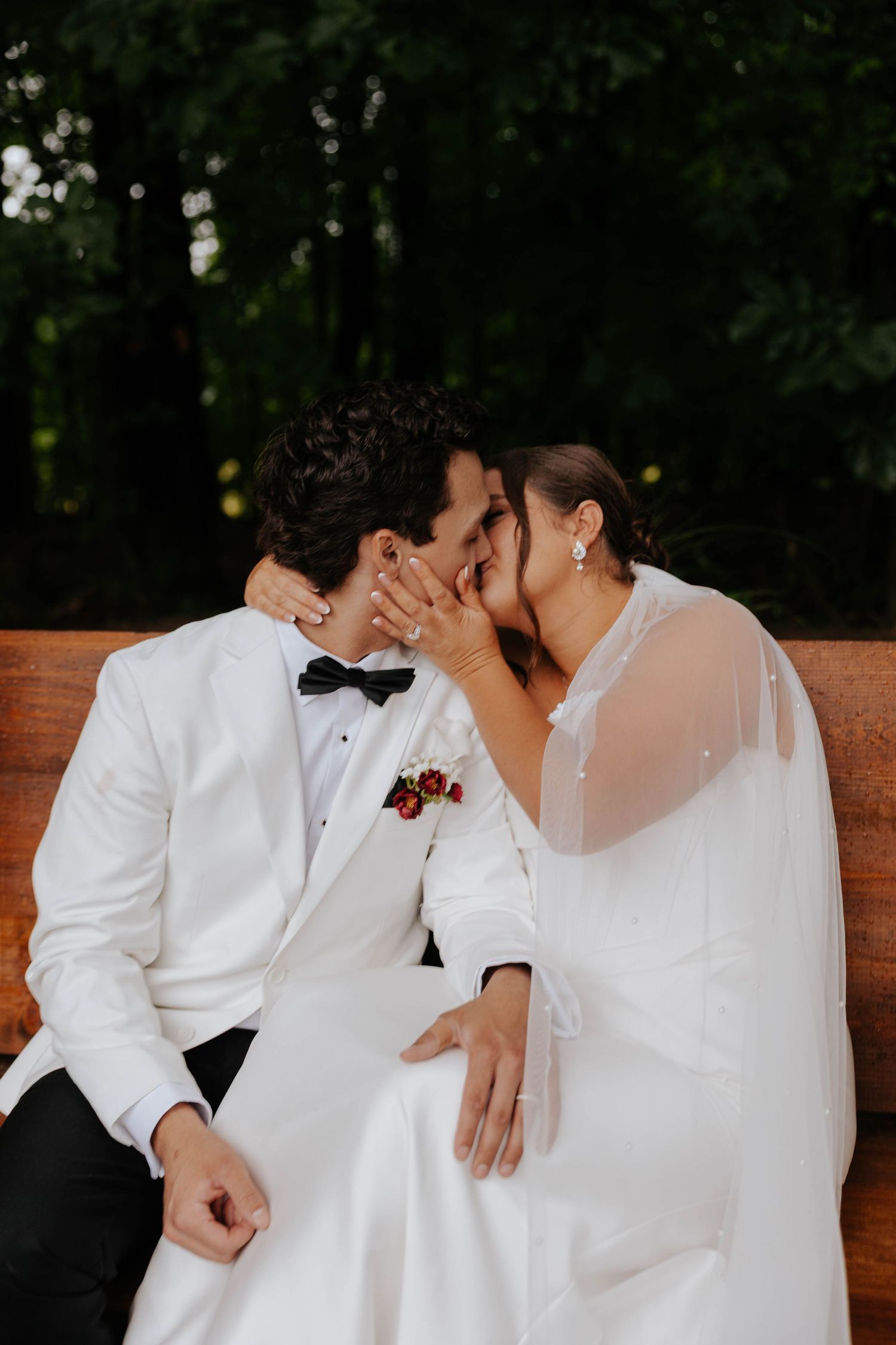 Romantic wedding portrait of a bride and groom sharing an intimate moment outdoors in Battle Creek, Michigan.