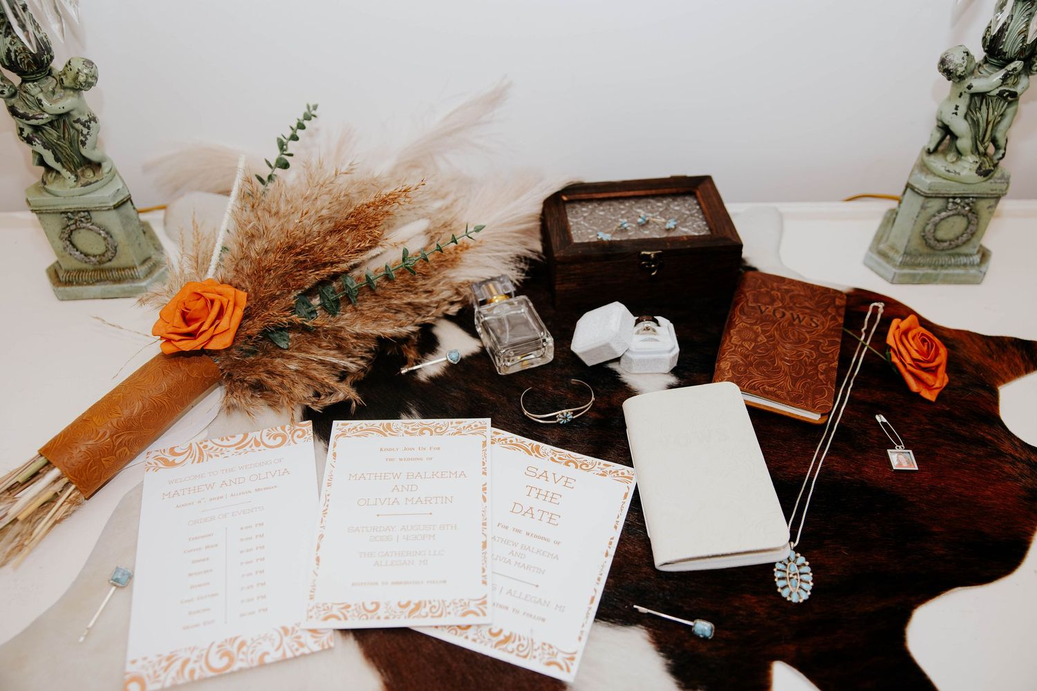 Rustic wedding detail flat lay featuring an invitation suite, dried flowers, and personal keepsakes at The Gather in Allegan, Michigan.