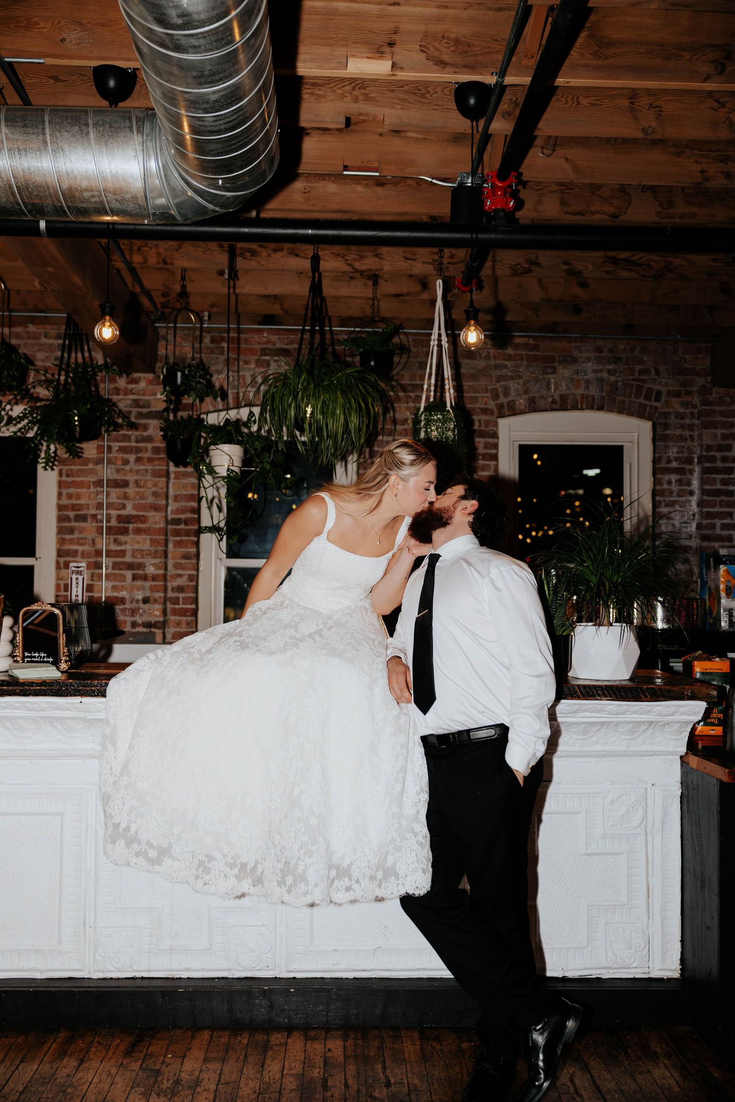 Bride and groom sharing a romantic portrait inside The Record Box Loft In Battle Creek Michigan