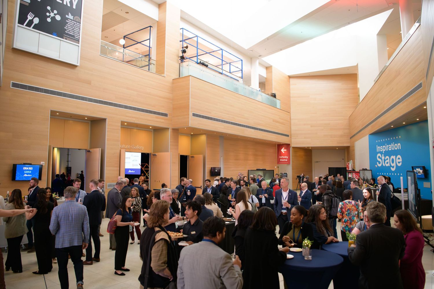 Wide shot of event guests mingling at corporate event, Calgary event photographer