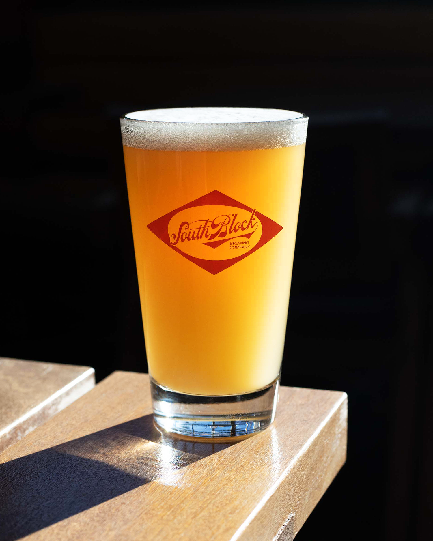 Pint with foam on top at South Block Beer & BBQ, Calgary beverage photographer