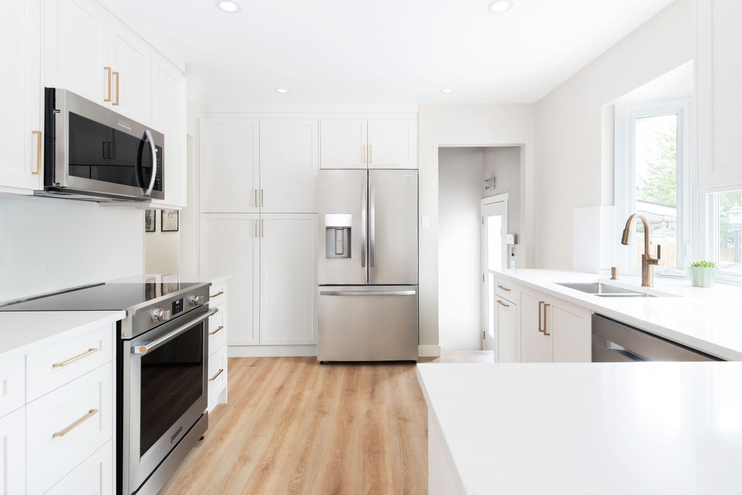 Modern white kitchen with quartz countertops, Calgary interior photographer
