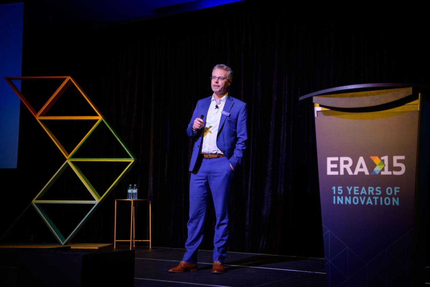 Speaker at podium during corporate conference, Calgary event photography