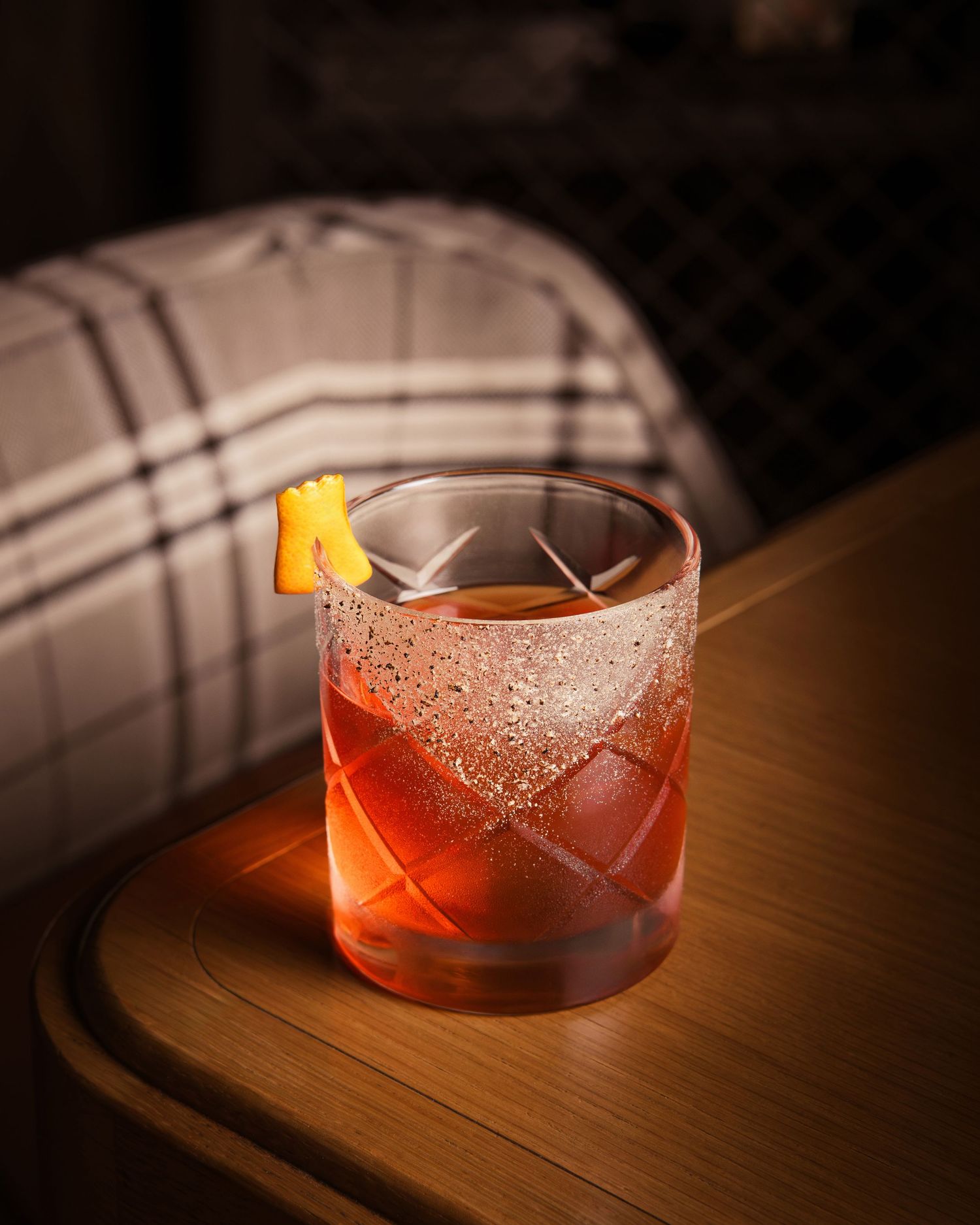 Cocktail with garnish on bar top, Calgary beverage photographer