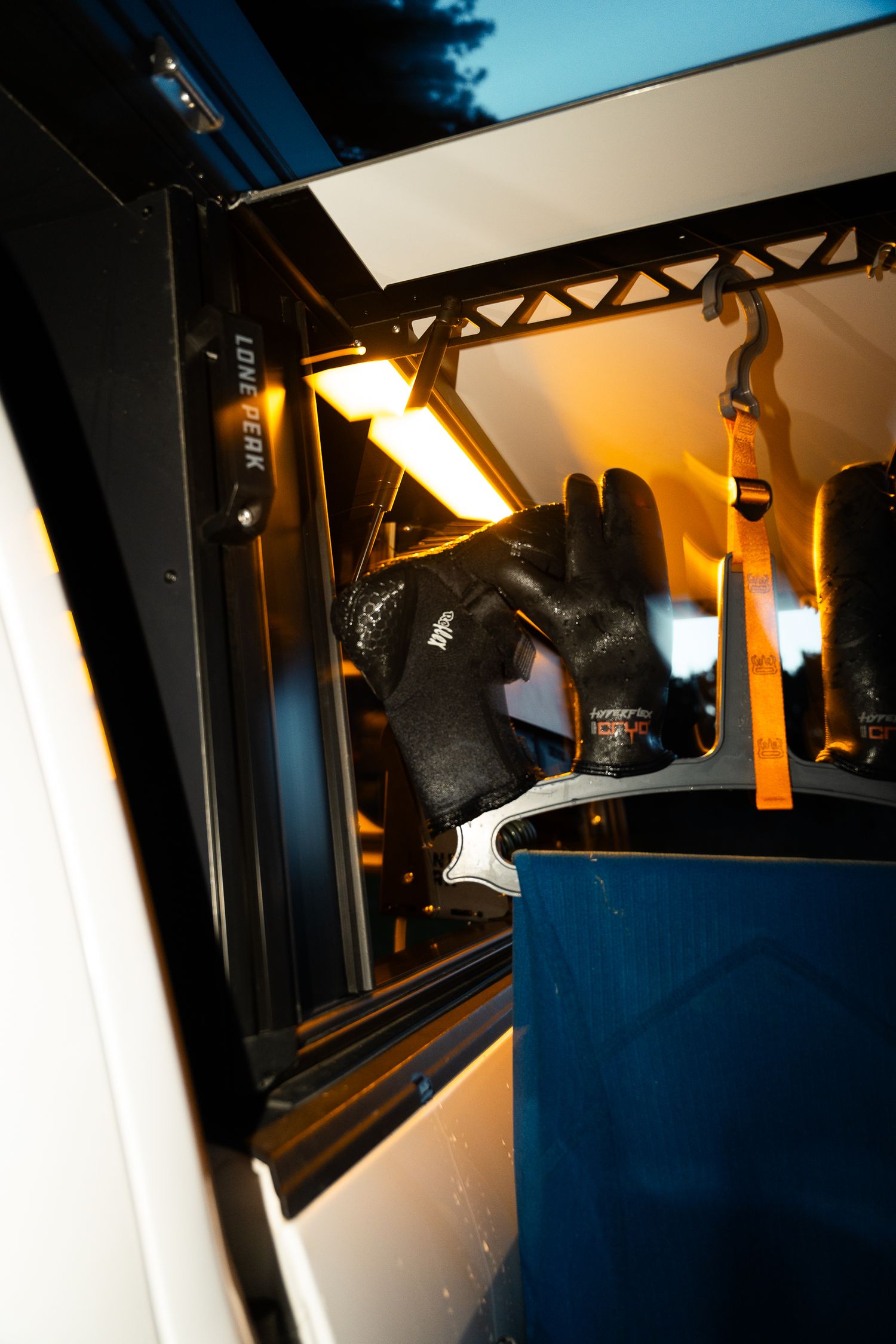 Lone peak side compartment with wetsuit hanging to dry on c-monsta hanger