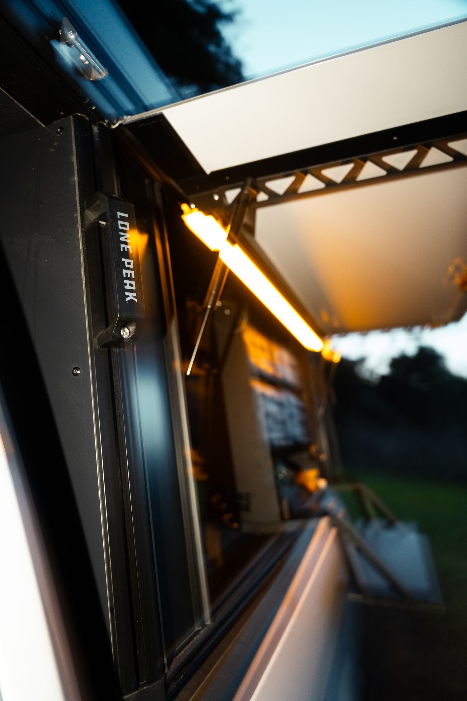 Lone peak side compartment with wetsuit hanging to dry on c-monsta hanger