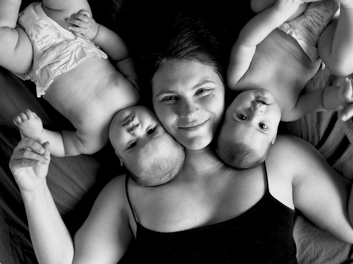 Self-portrait of The Mother's Eye photographer with her baby twins. Motherhood and postpartum photography in Penge, South East London.