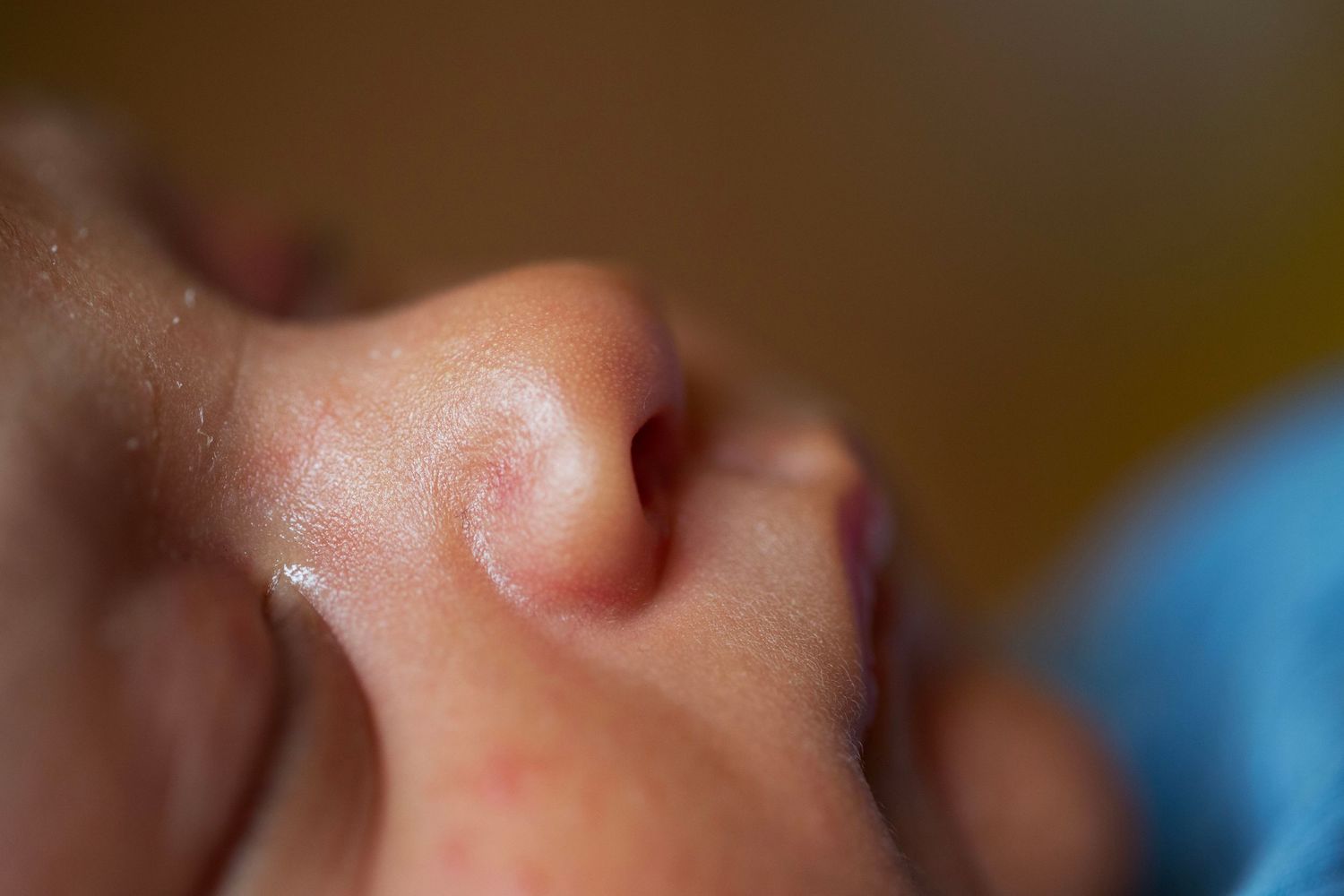 Close up - newborn sleeping. Poetic documentary childhood, newborn and family photography by The Mother's Eye, Battersea, South East London.