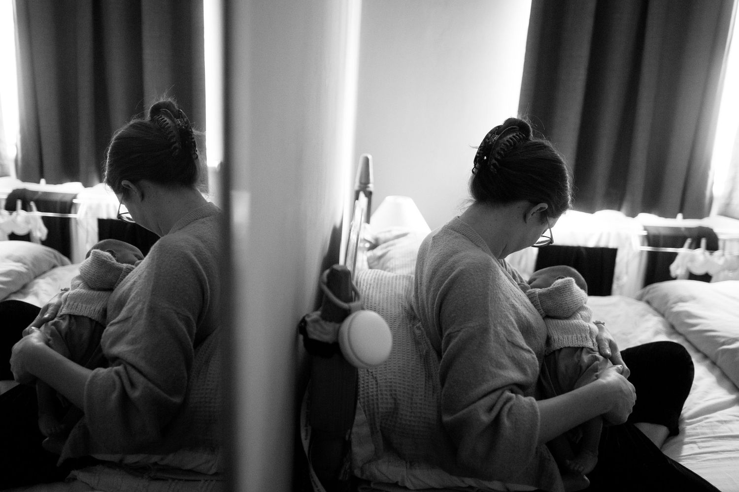 Portrait of mum and newborn breastfeeding. Candid newborn, matrescence, postpartum and photography by The Mother's Eye in Peckham, London.