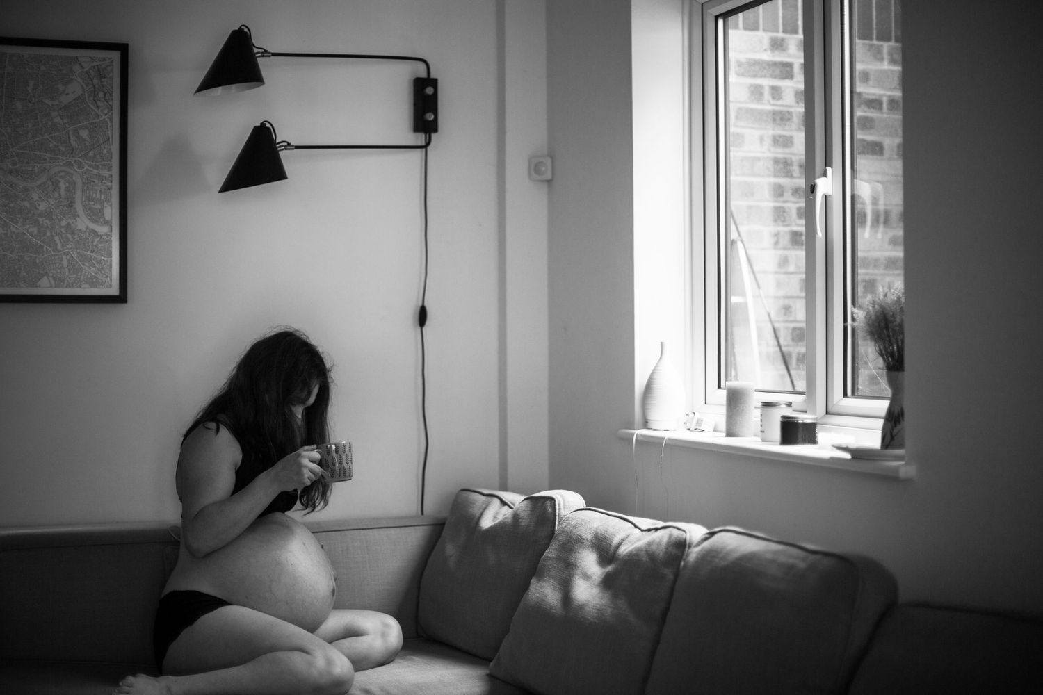 Pregnancy home photo session of The Mother's Eye photographer Gloria Kurnik. Documentary maternity session in Croydon, South East London.