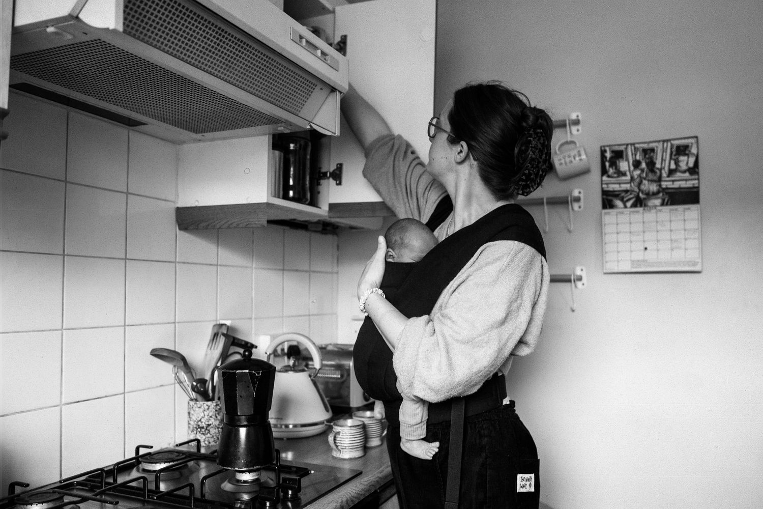Mum making coffee with her newborn. The Mother's Eye - candid documentary-stele motherhood photography in Crystal Palace, SE London.