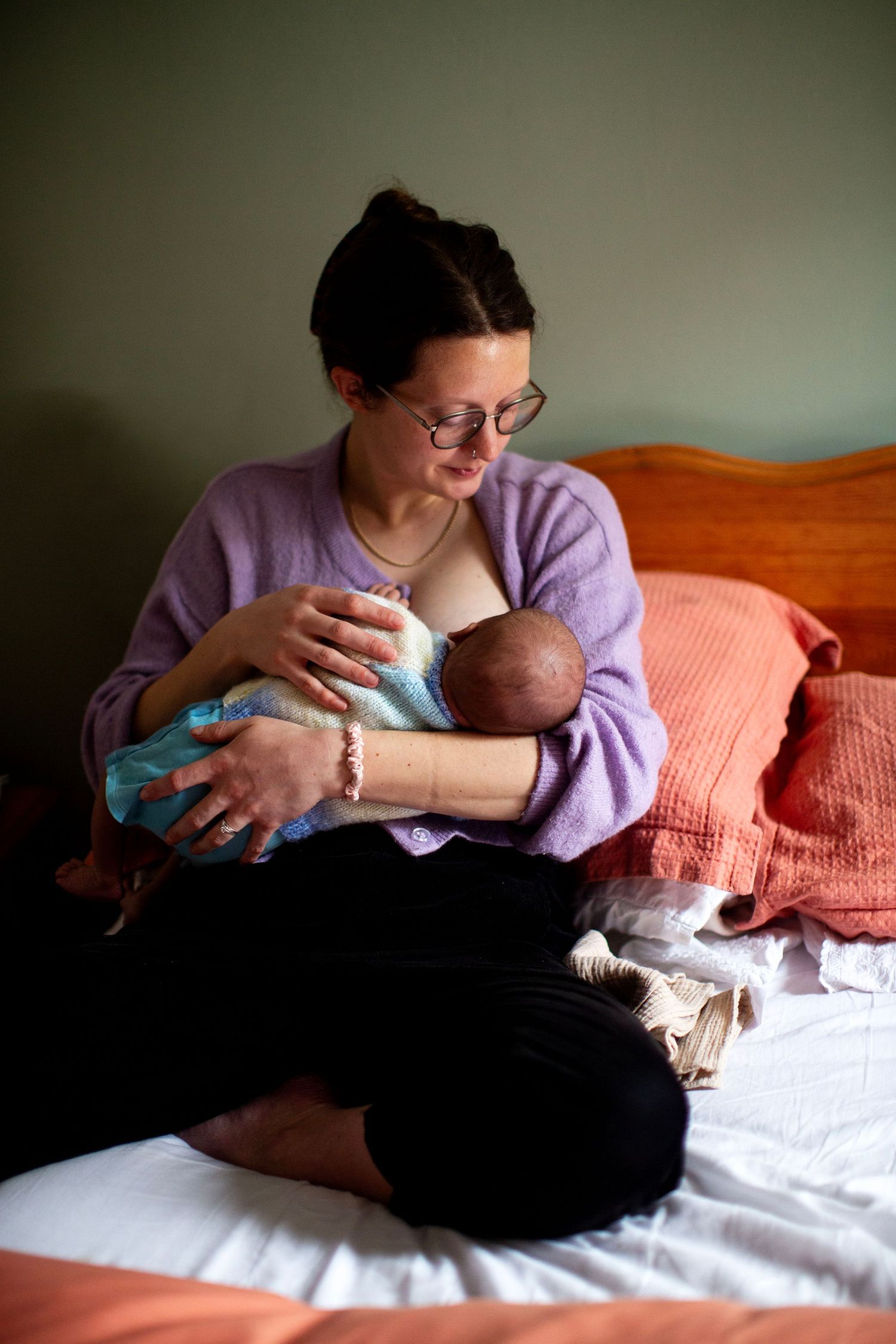 Mum breastfeeding a newborn. Newborn, matrescence, postpartum and Fourth Trimester photography - The Mother's Eye in Sydenham, South London.