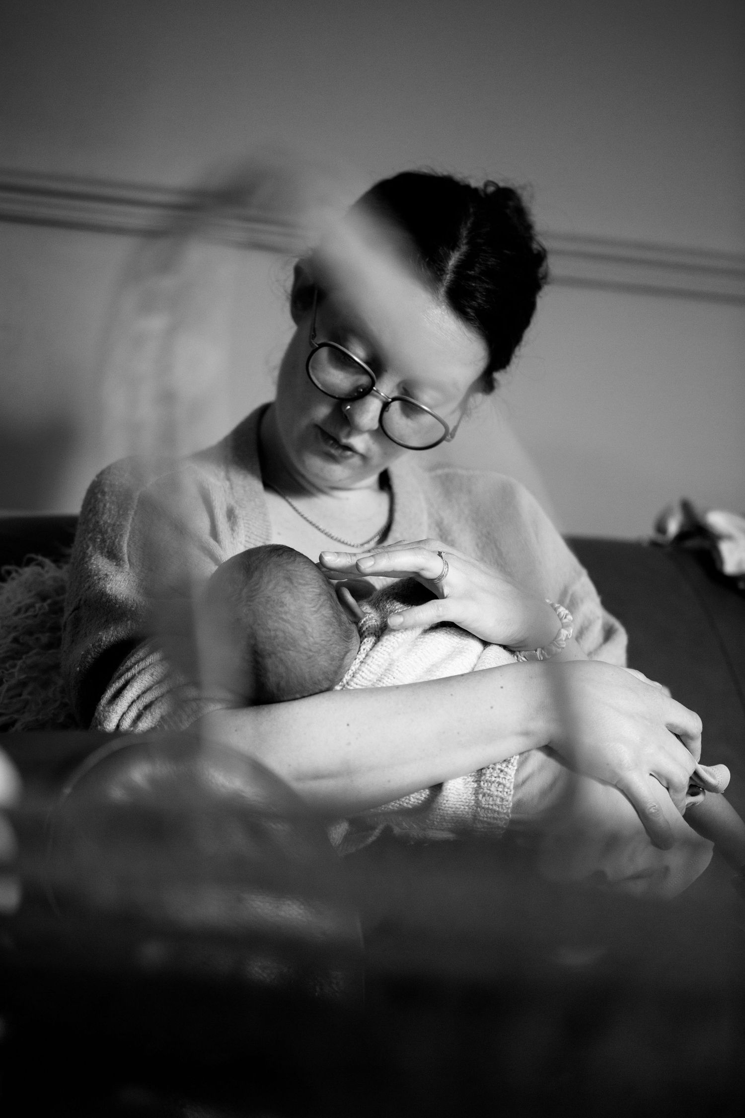 Portrait of mum and newborn breastfeeding. Candid newborn, matrescence, postpartum and photography by The Mother's Eye in Bromley, London.