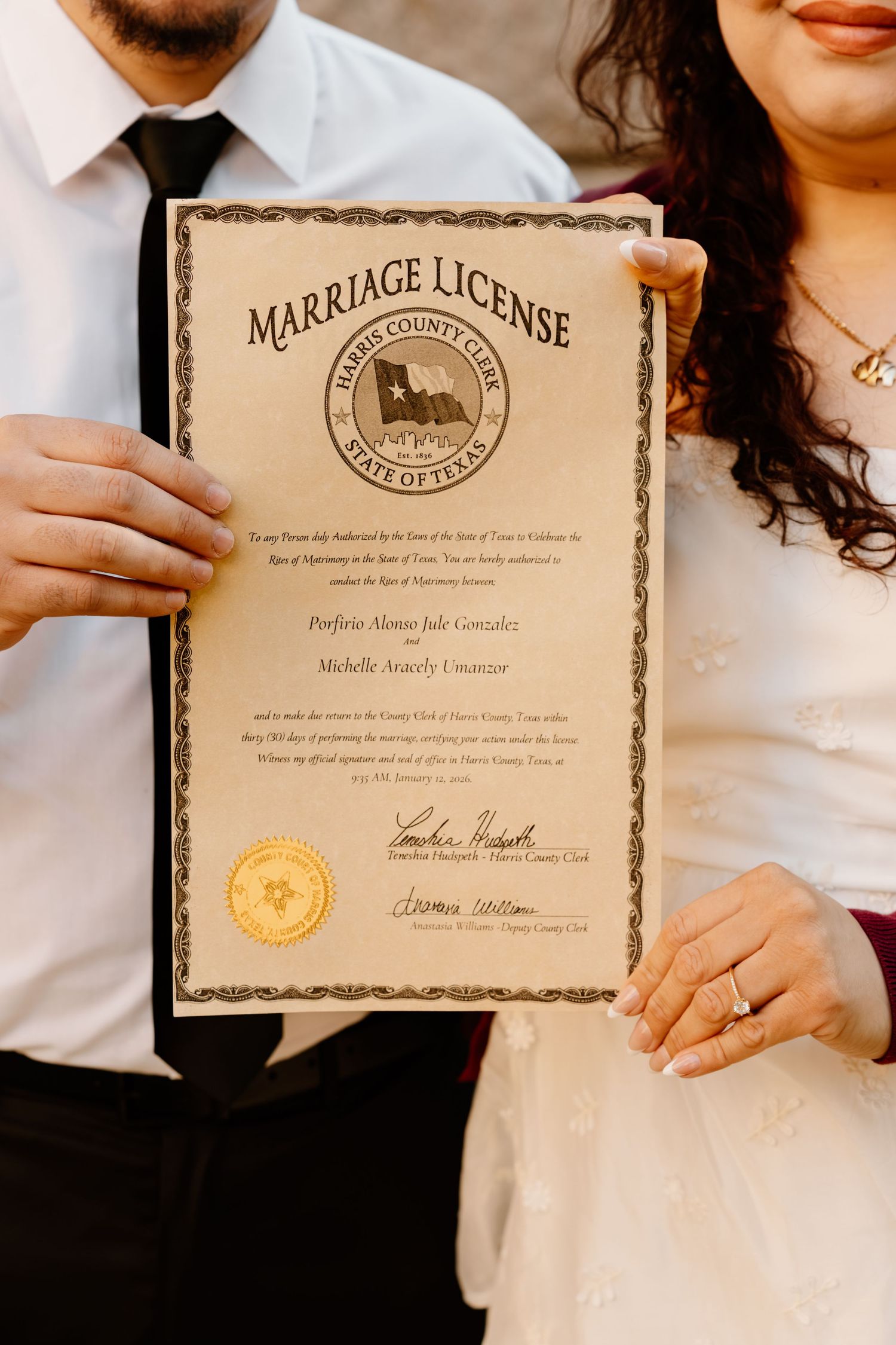 Newlyweds hold Harris County Texas Marriage License certificate after courthouse wedding ceremony.