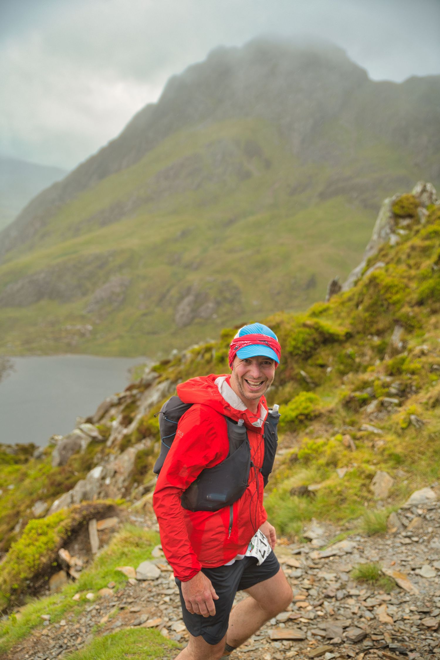 Competitor during the Welsh 1000 m race enjoying the steep mountains of Ogwen and the heavy rain and wind of the Snowdonia National Park