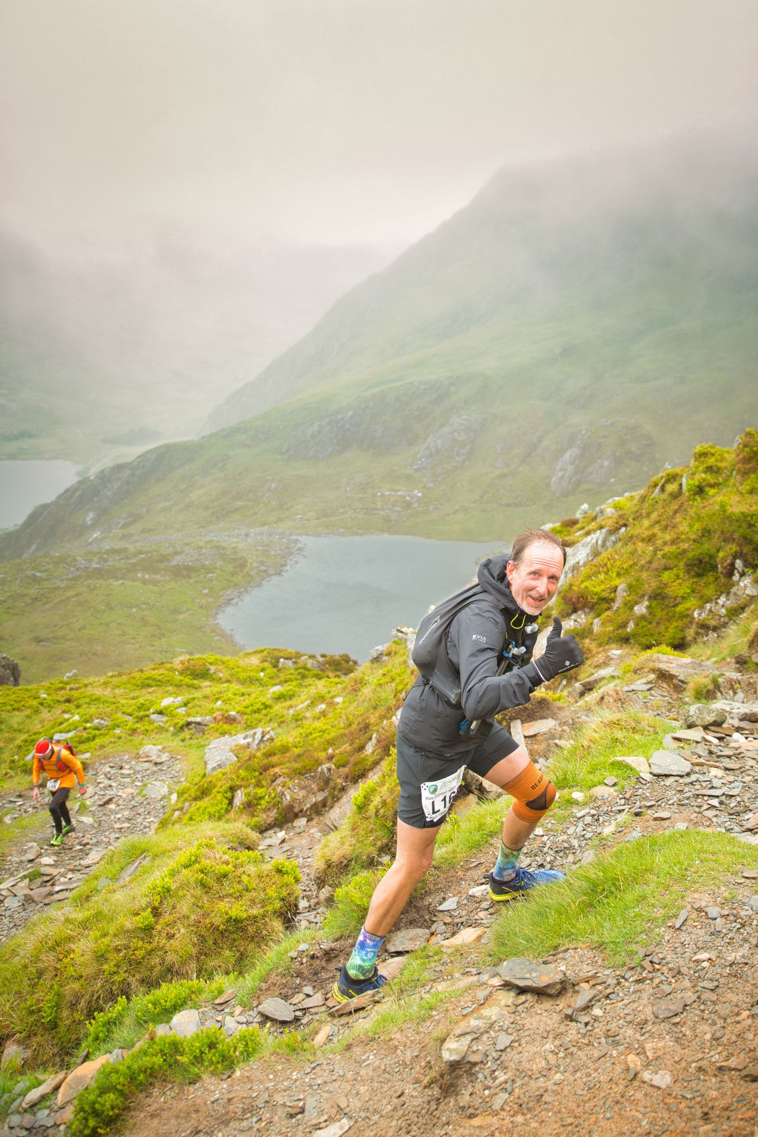 Competitor during the Welsh 1000 m race enjoying the steep mountains of Ogwen and the heavy rain and wind of the Snowdonia National Park
