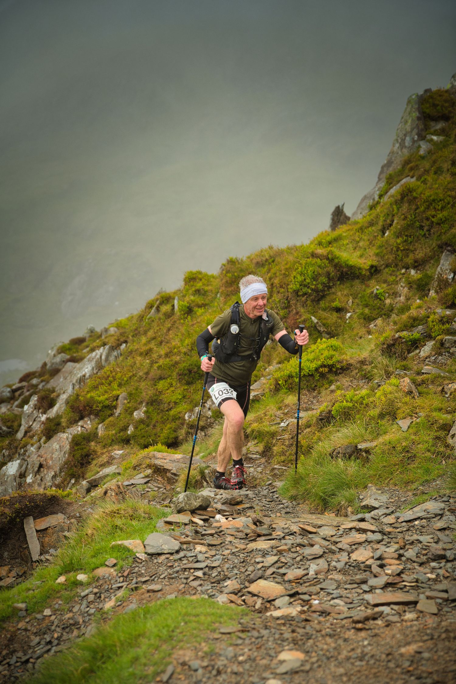 Competitor during the Welsh 1000 m race enjoying the steep mountains of Ogwen and the heavy rain and wind of the Snowdonia National Park
