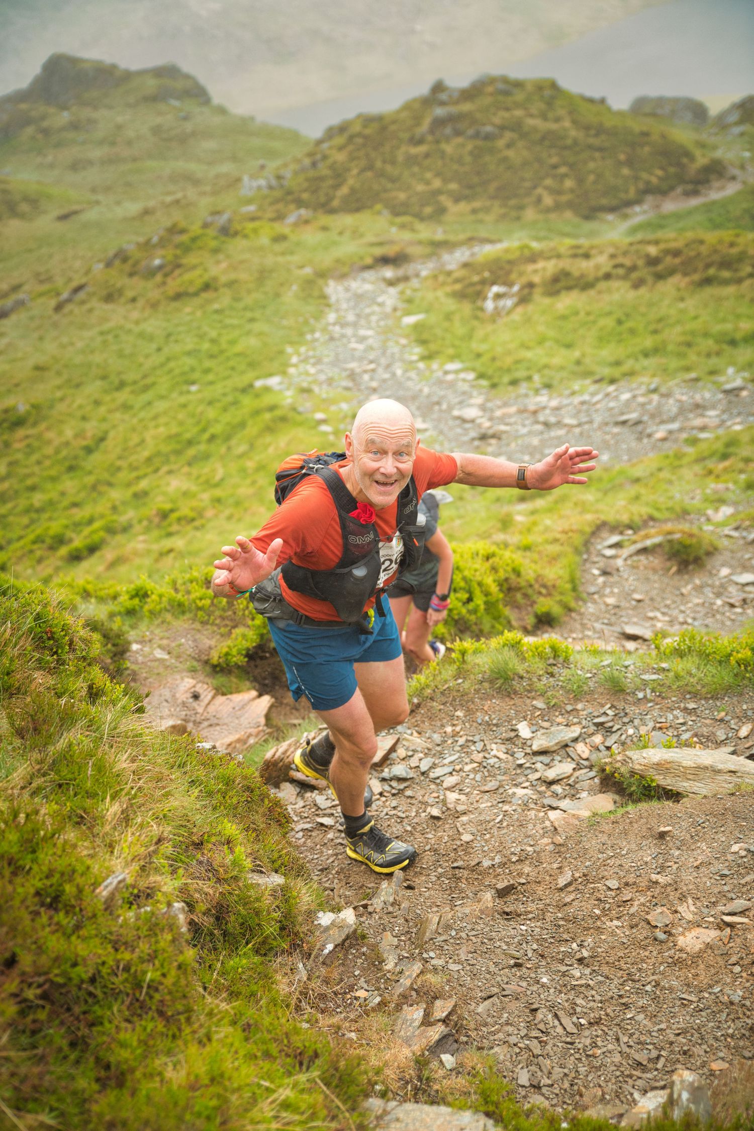 Competitor during the Welsh 1000 m race enjoying the steep mountains of Ogwen and the heavy rain and wind of the Snowdonia National Park
