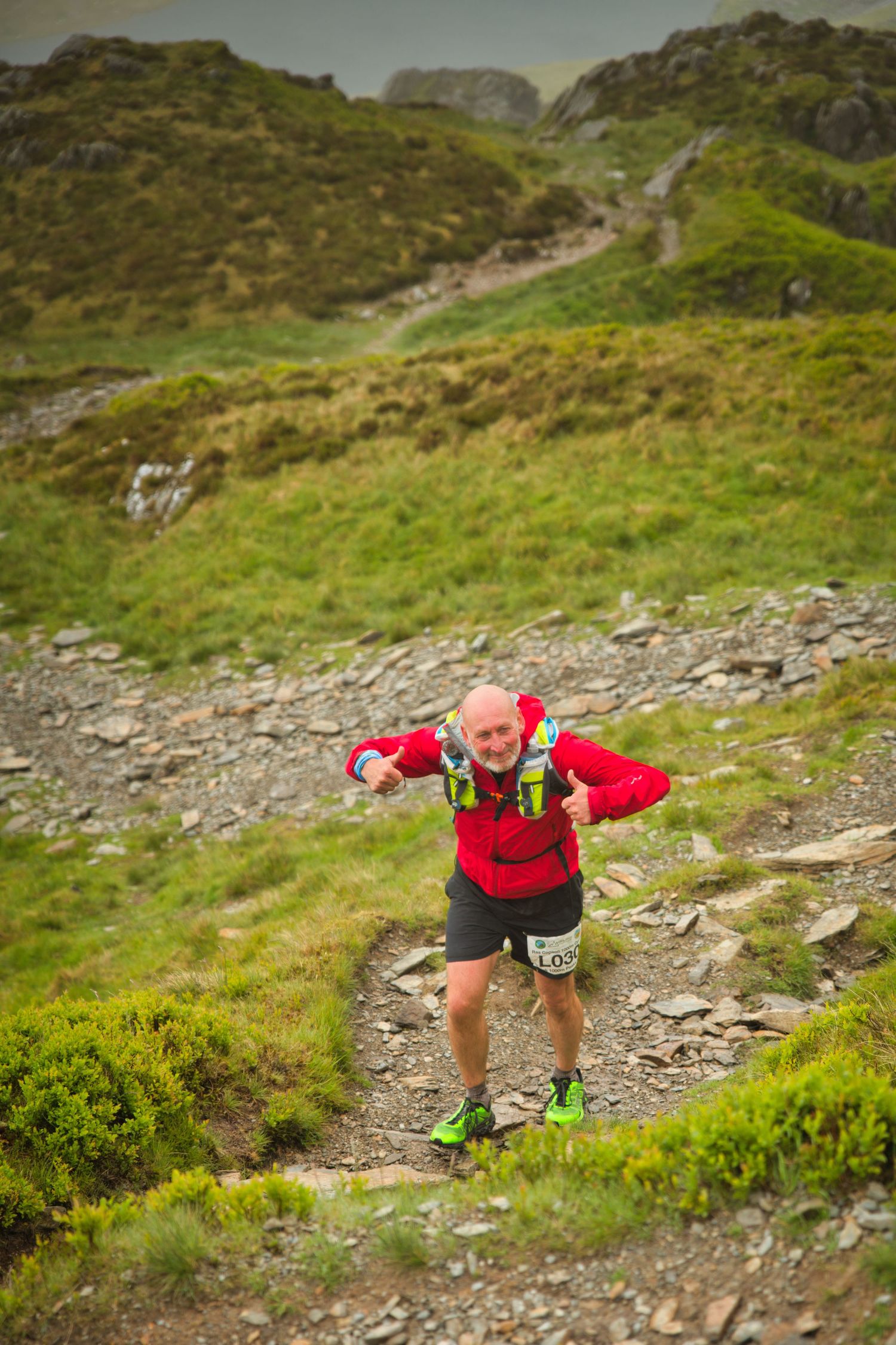 Competitor during the Welsh 1000 m race enjoying the steep mountains of Ogwen and the heavy rain and wind of the Snowdonia National Park
