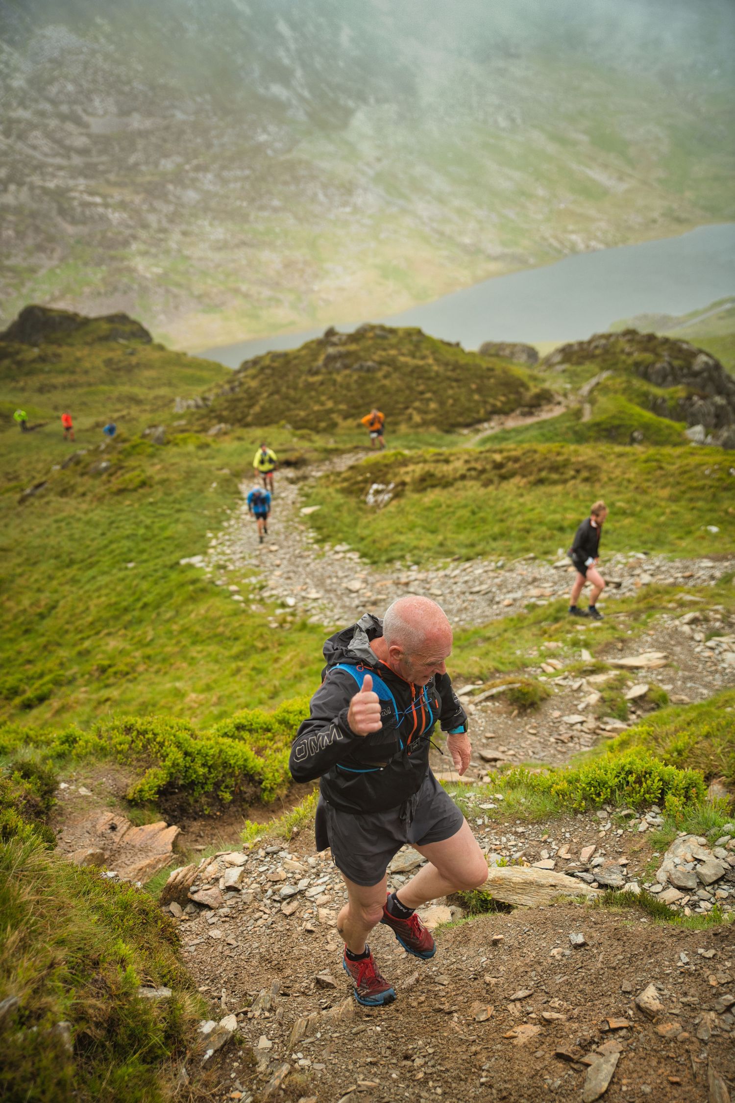 Competitor during the Welsh 1000 m race enjoying the steep mountains of Ogwen and the heavy rain and wind of the Snowdonia National Park