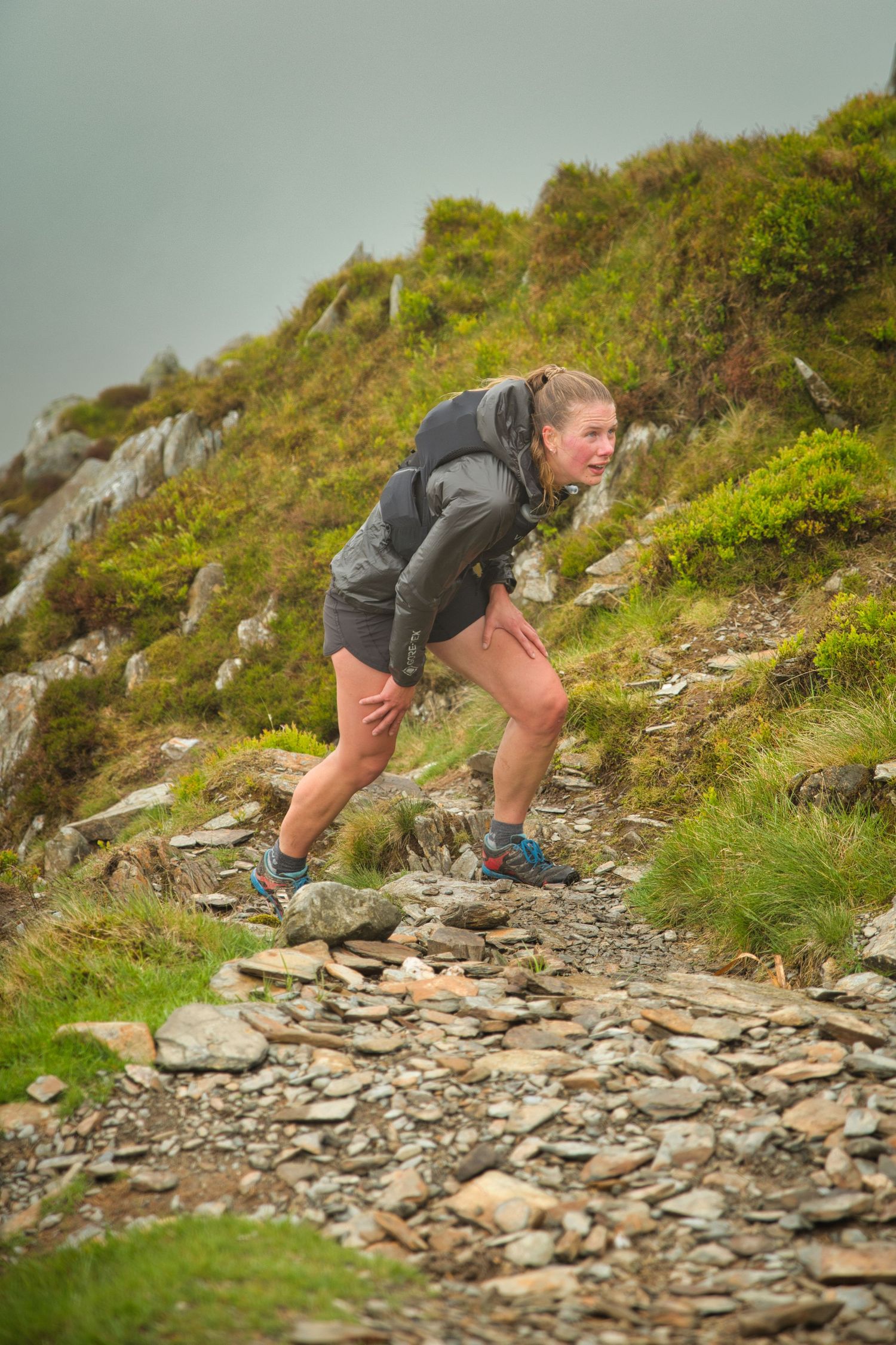 Competitor during the Welsh 1000 m race enjoying the steep mountains of Ogwen and the heavy rain and wind of the Snowdonia National Park