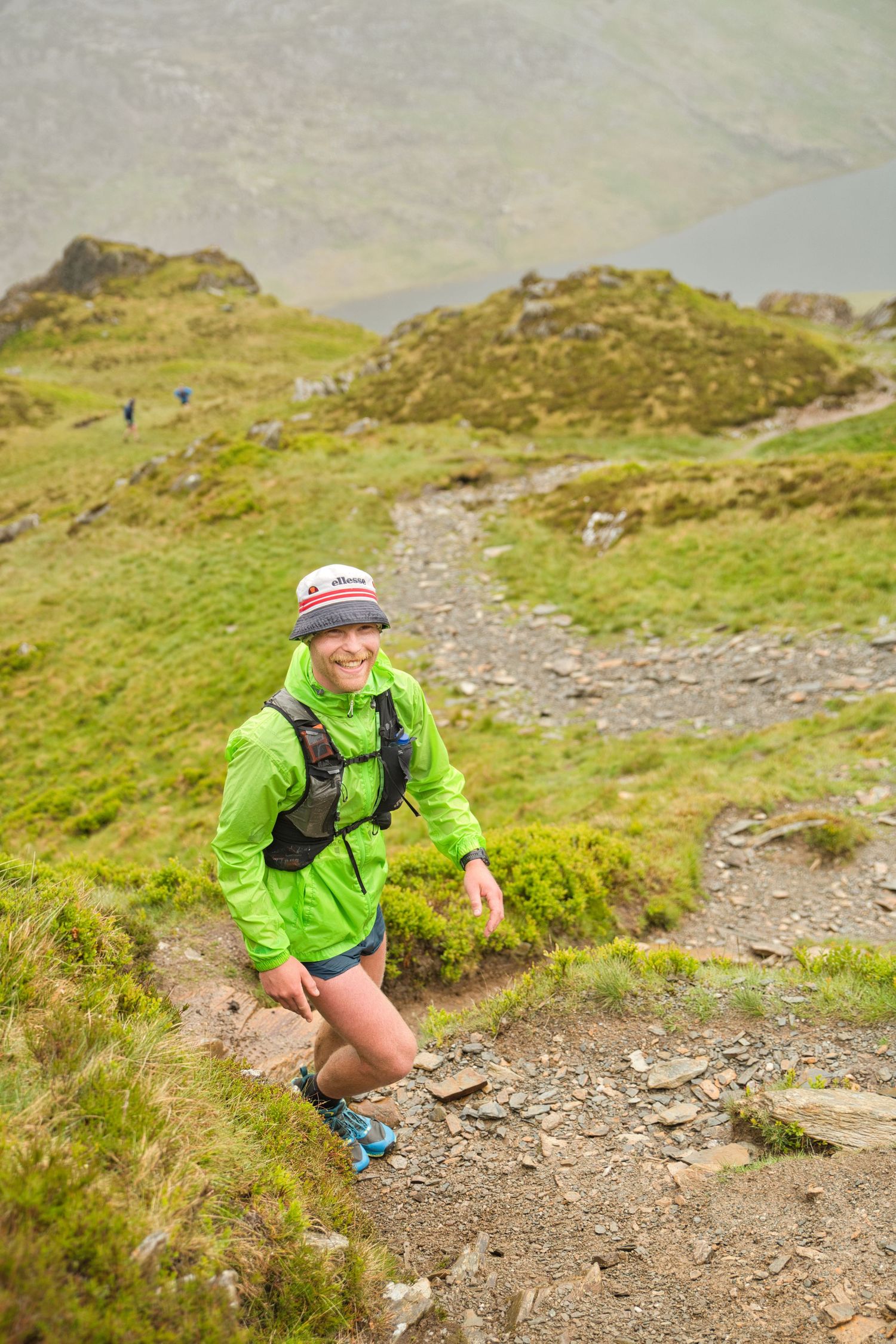 Competitor during the Welsh 1000 m race enjoying the steep mountains of Ogwen and the heavy rain and wind of the Snowdonia National Park