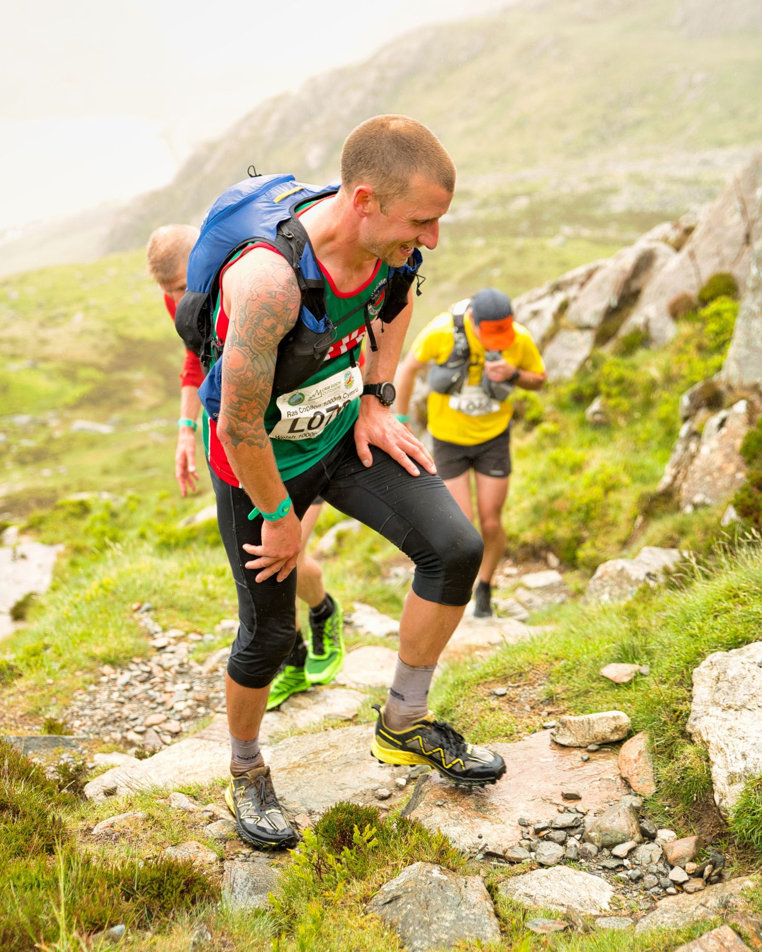 Competitor during the Welsh 1000 m race enjoying the steep mountains of Ogwen and the heavy rain and wind of the Snowdonia National Park