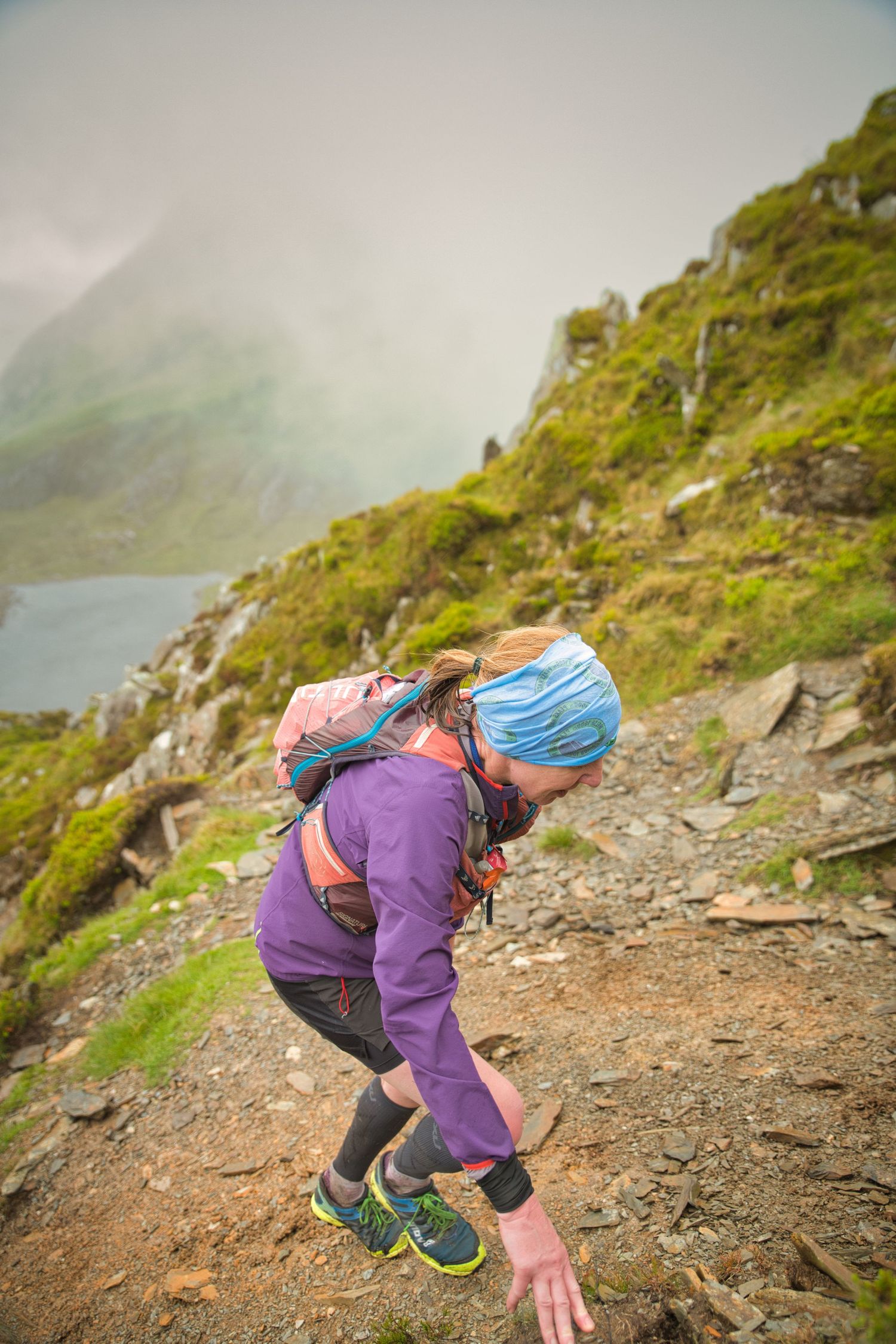 Competitor during the Welsh 1000 m race enjoying the steep mountains of Ogwen and the heavy rain and wind of the Snowdonia National Park