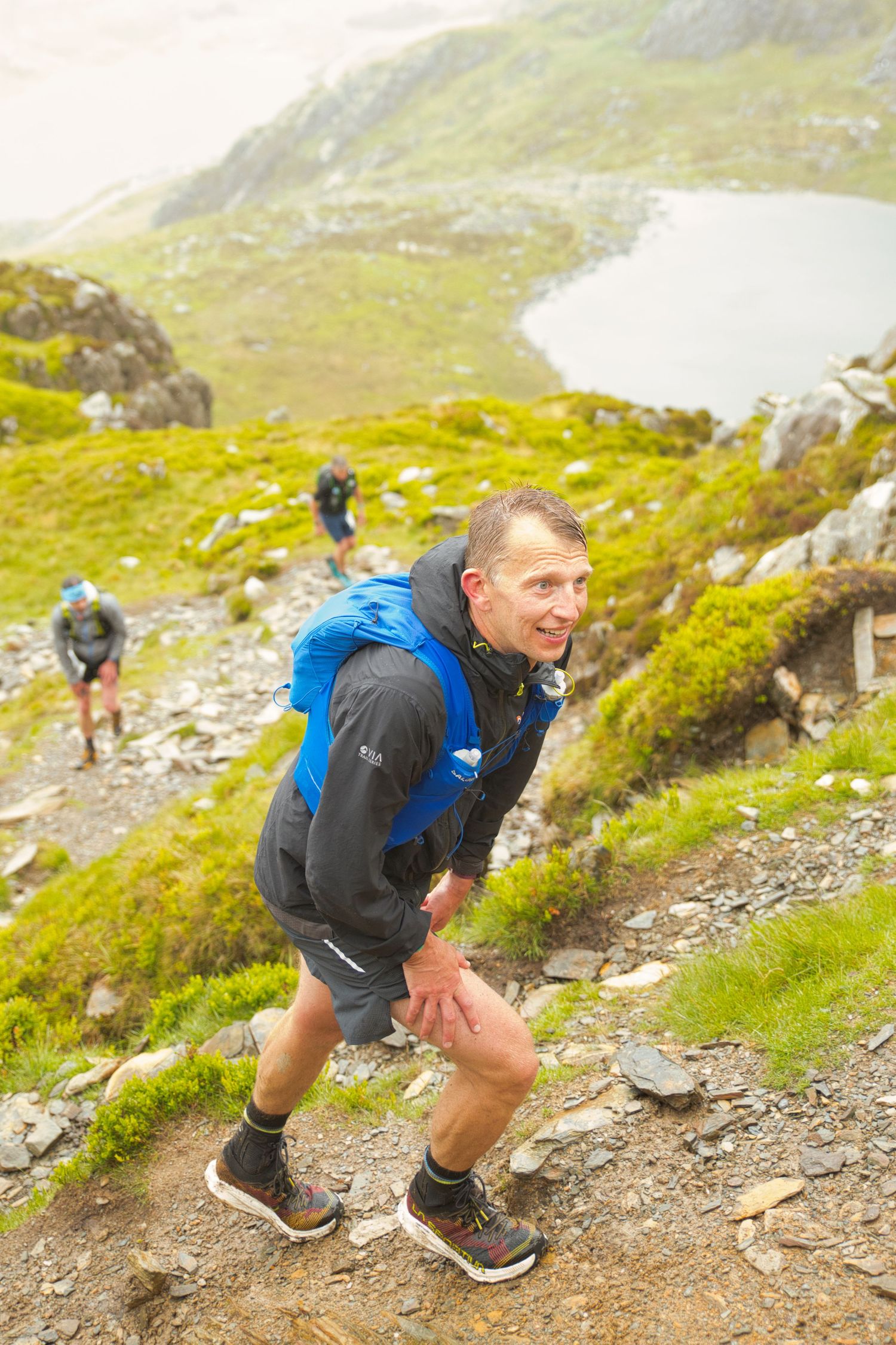 Competitor during the Welsh 1000 m race enjoying the steep mountains of Ogwen and the heavy rain and wind of the Snowdonia National Park