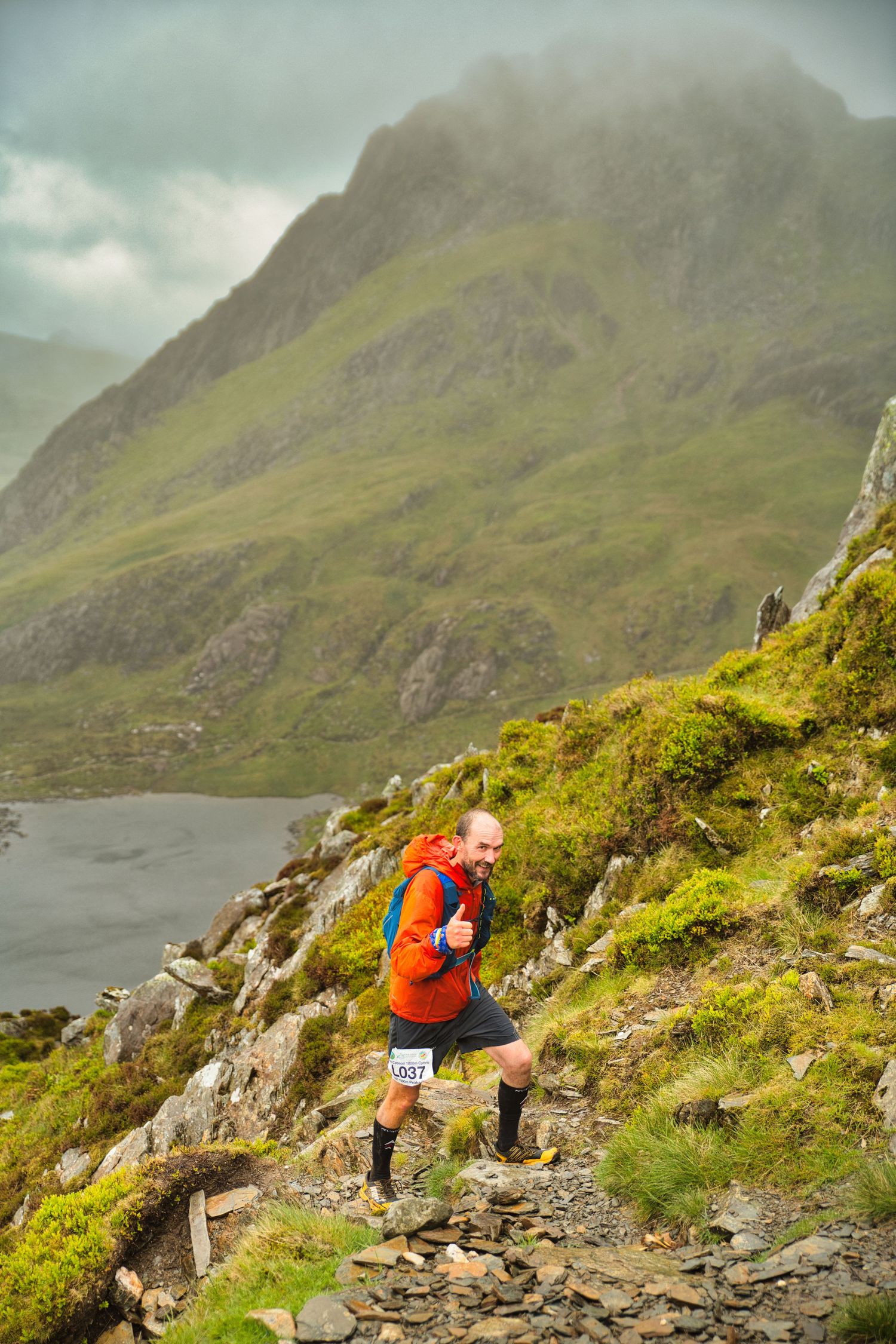 Competitor during the Welsh 1000 m race enjoying the steep mountains of Ogwen and the heavy rain and wind of the Snowdonia National Park