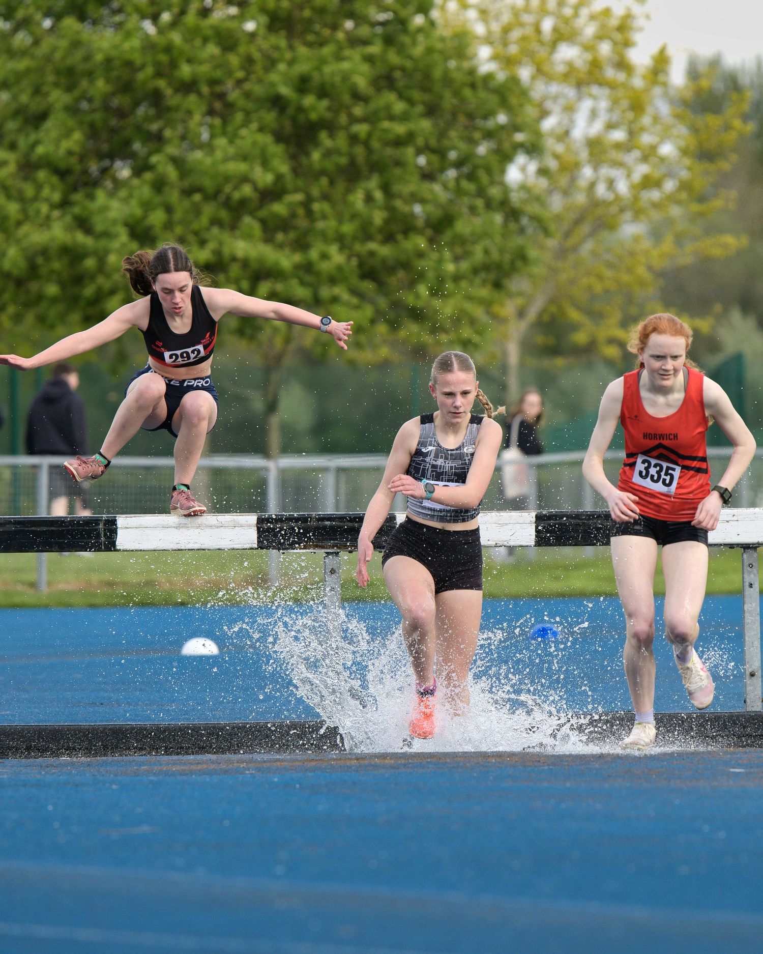 young athletes on the water jump steeplechase