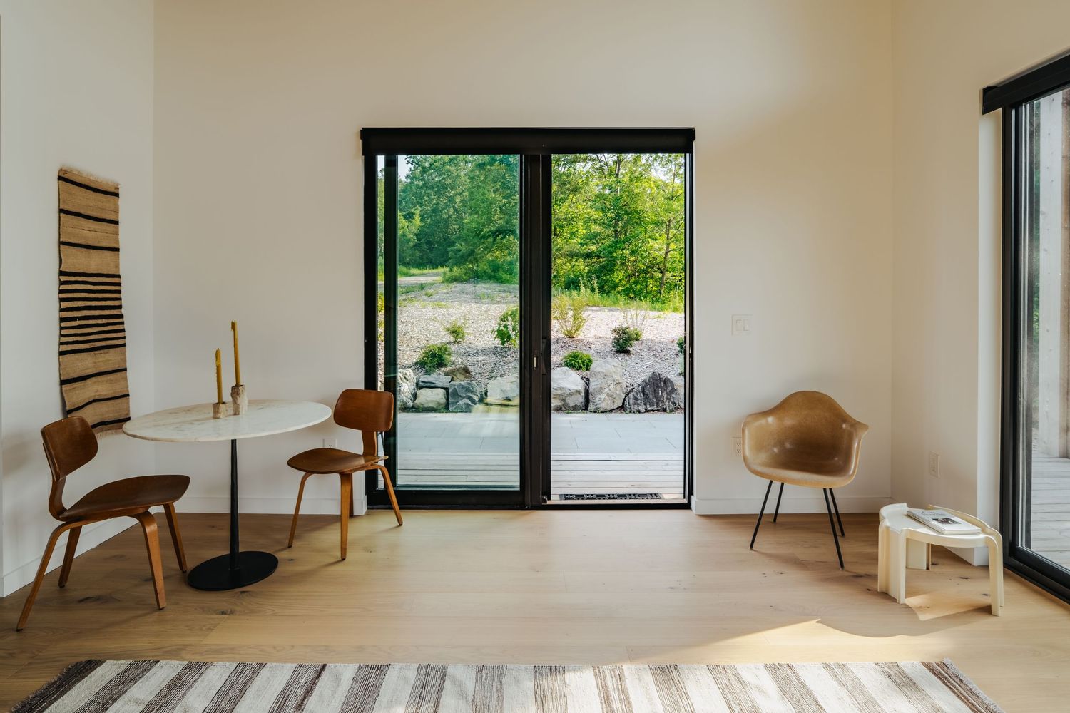Contemporary seating area with sliding glass doors leading to outdoor patio.