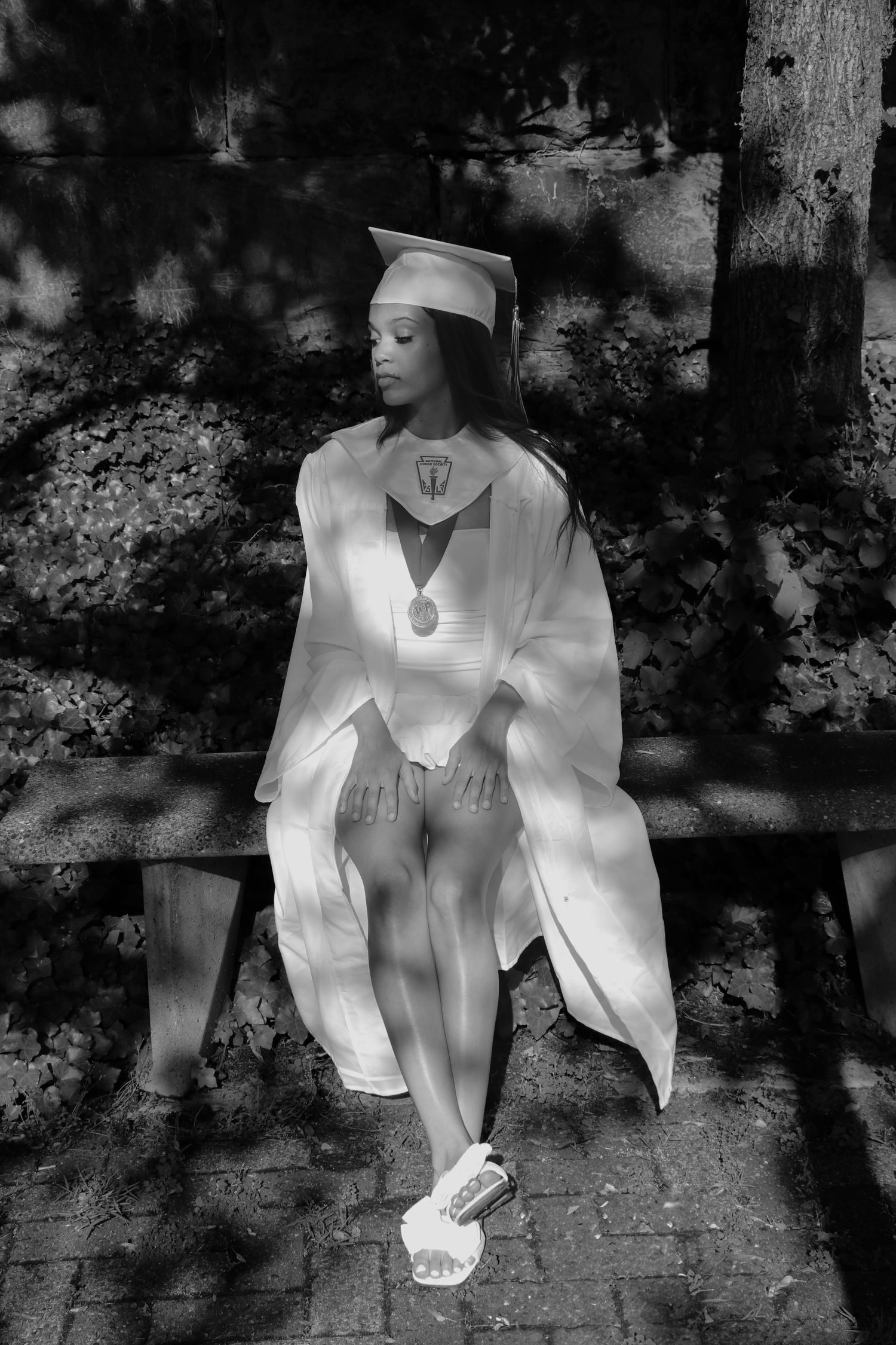 Artistic black and white portrait series showing details of traditional Japanese kimono and sandals in dappled sunlight.
