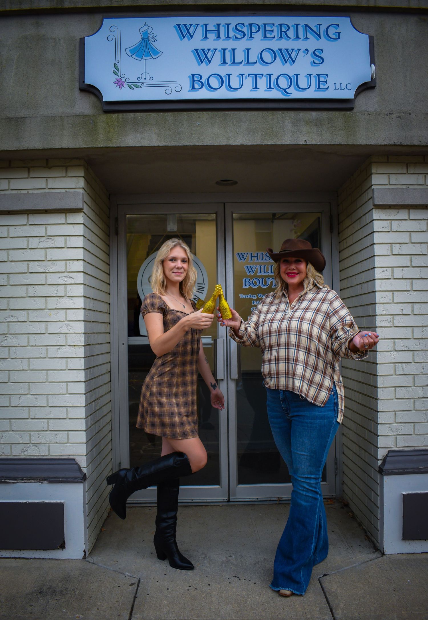 Playful poses captured outside Whispering Willow's Boutique entrance.