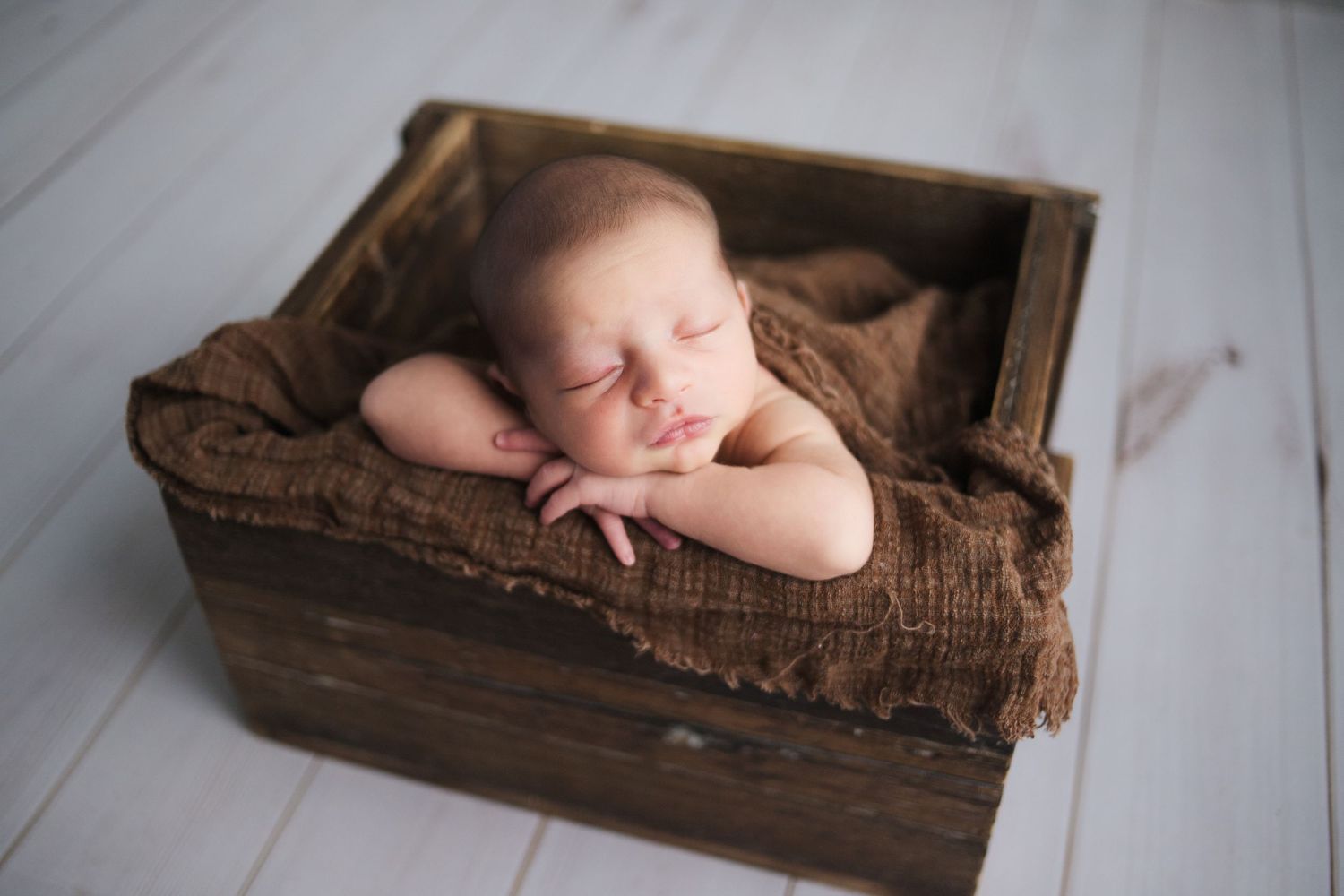 Newborn posed safely in bucket prop – Springfield MO studio newborn photographer focused on safety by Fairchild Photo Co